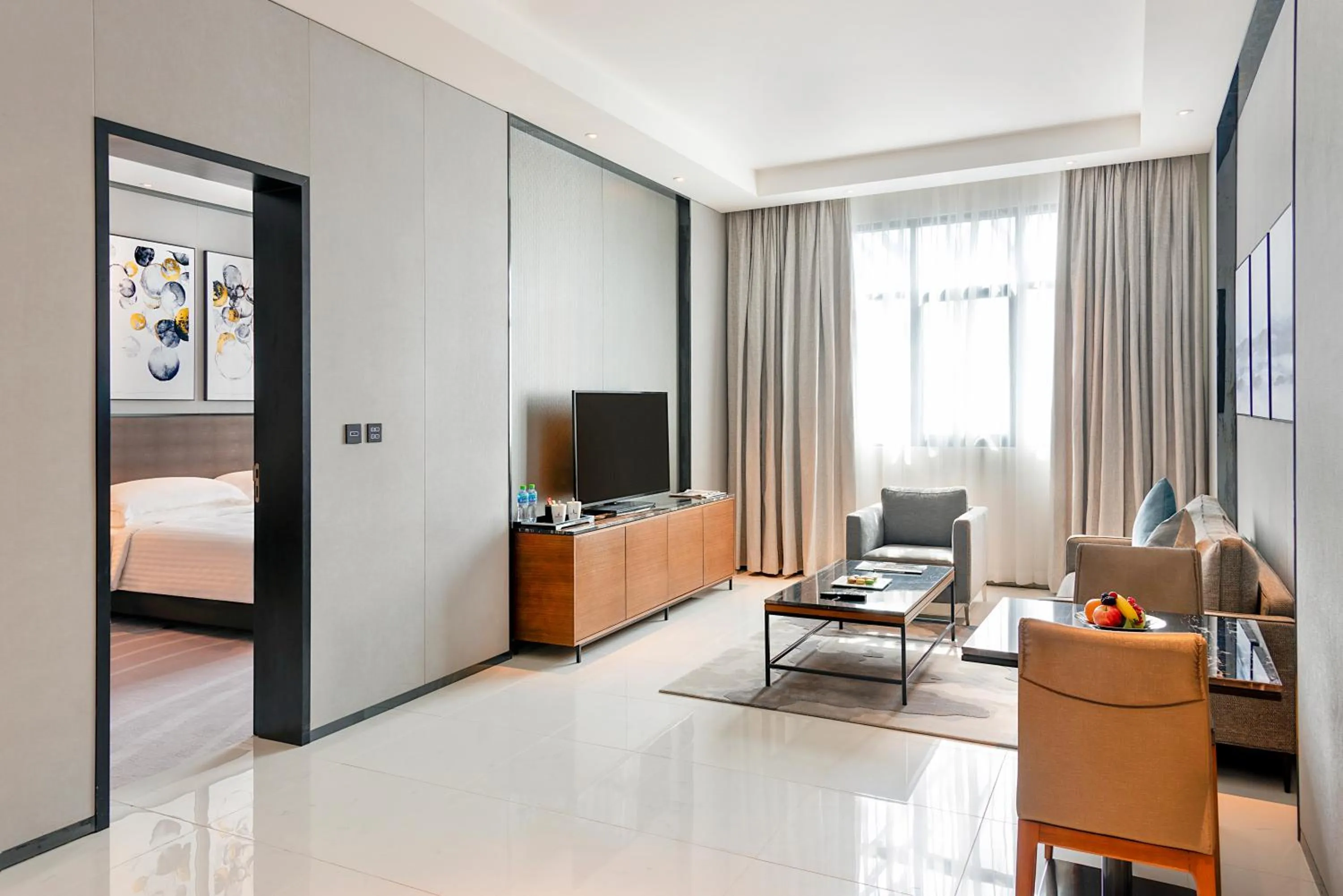 Living room, Bed in Asiana Grand Hotel