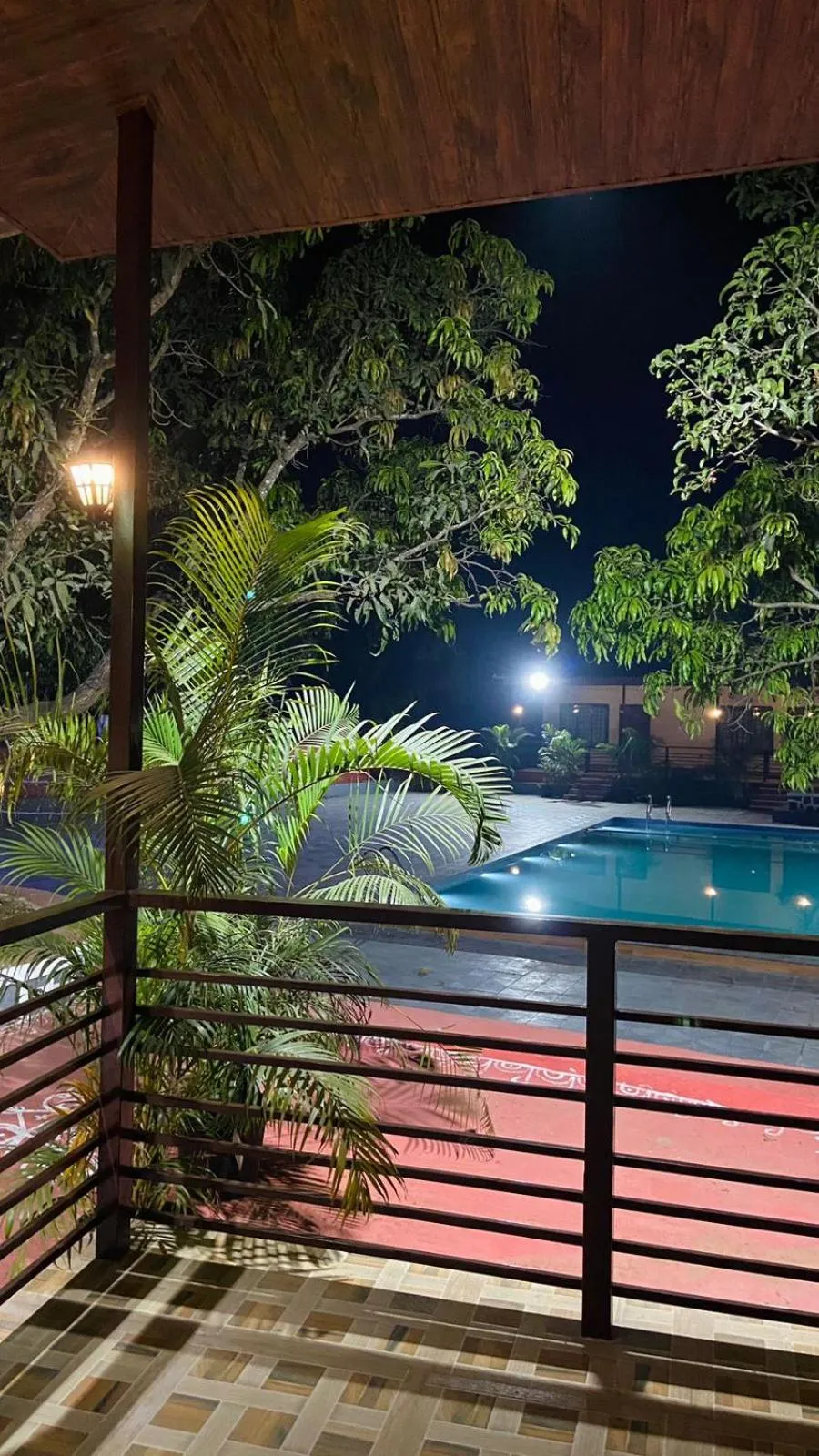 Swimming pool in Ashoka Lawns and Resort