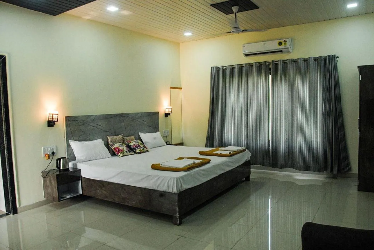 Bed in Ashoka Lawns and Resort