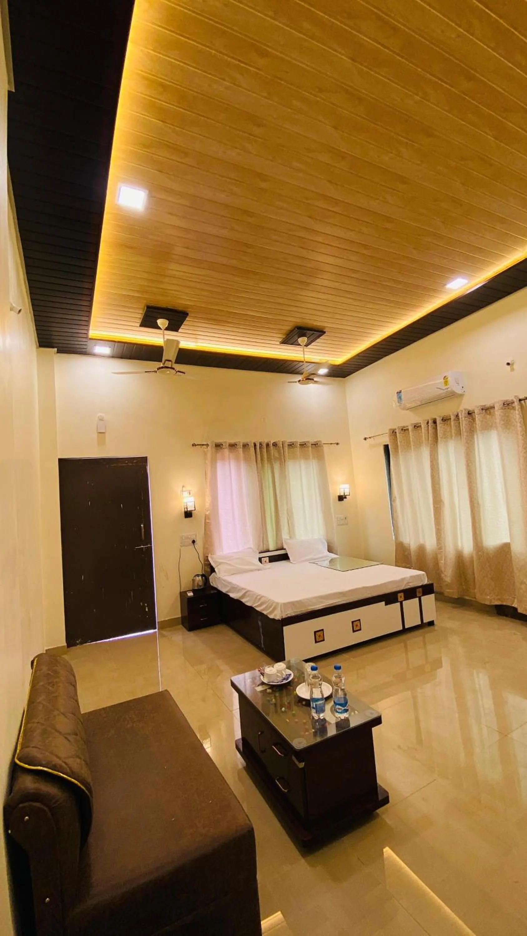 Seating area, Bed in Ashoka Lawns and Resort