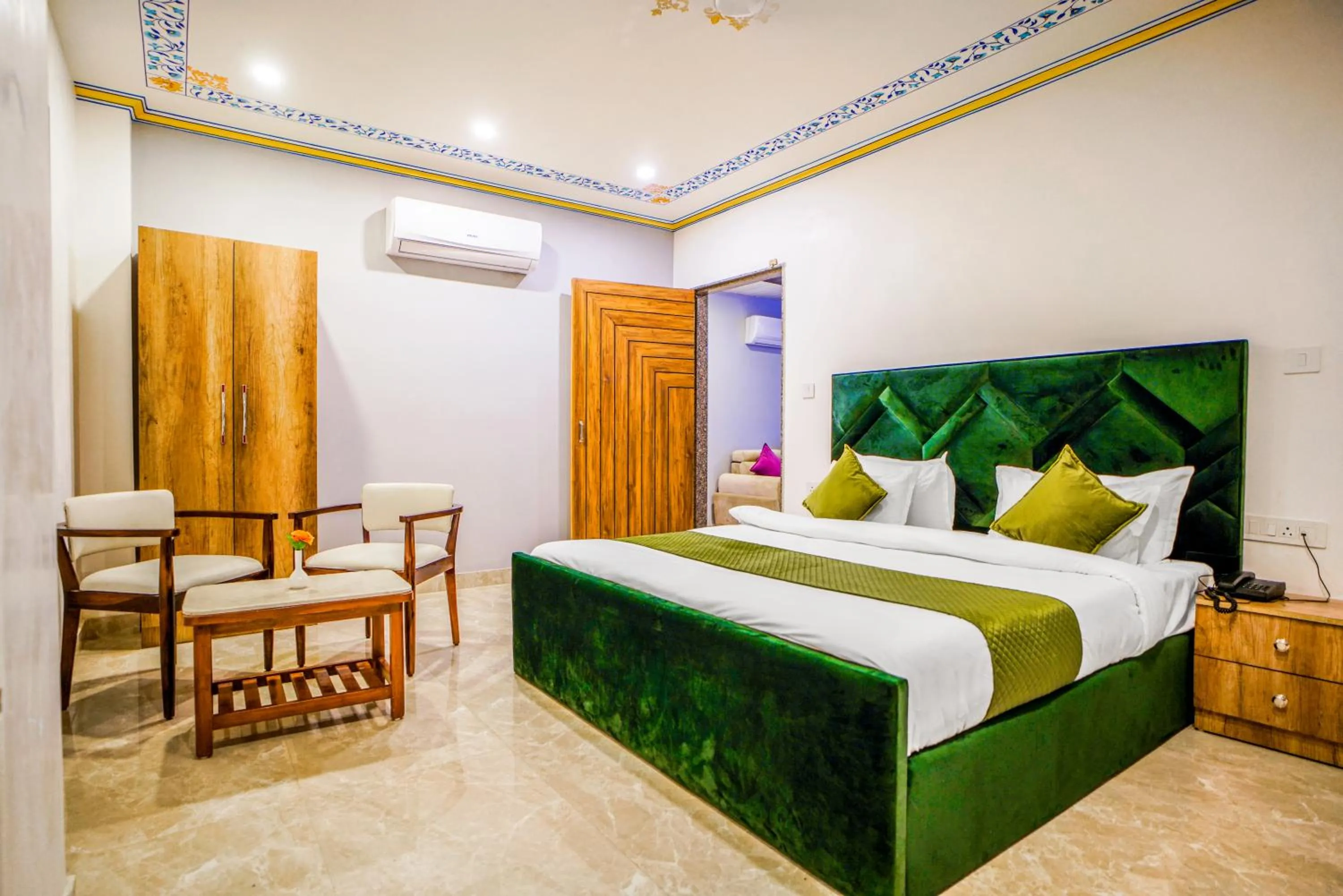 wardrobe, Bed in Pax Hotel Grand Blue 3 min walk from Udaipur city Railway Station
