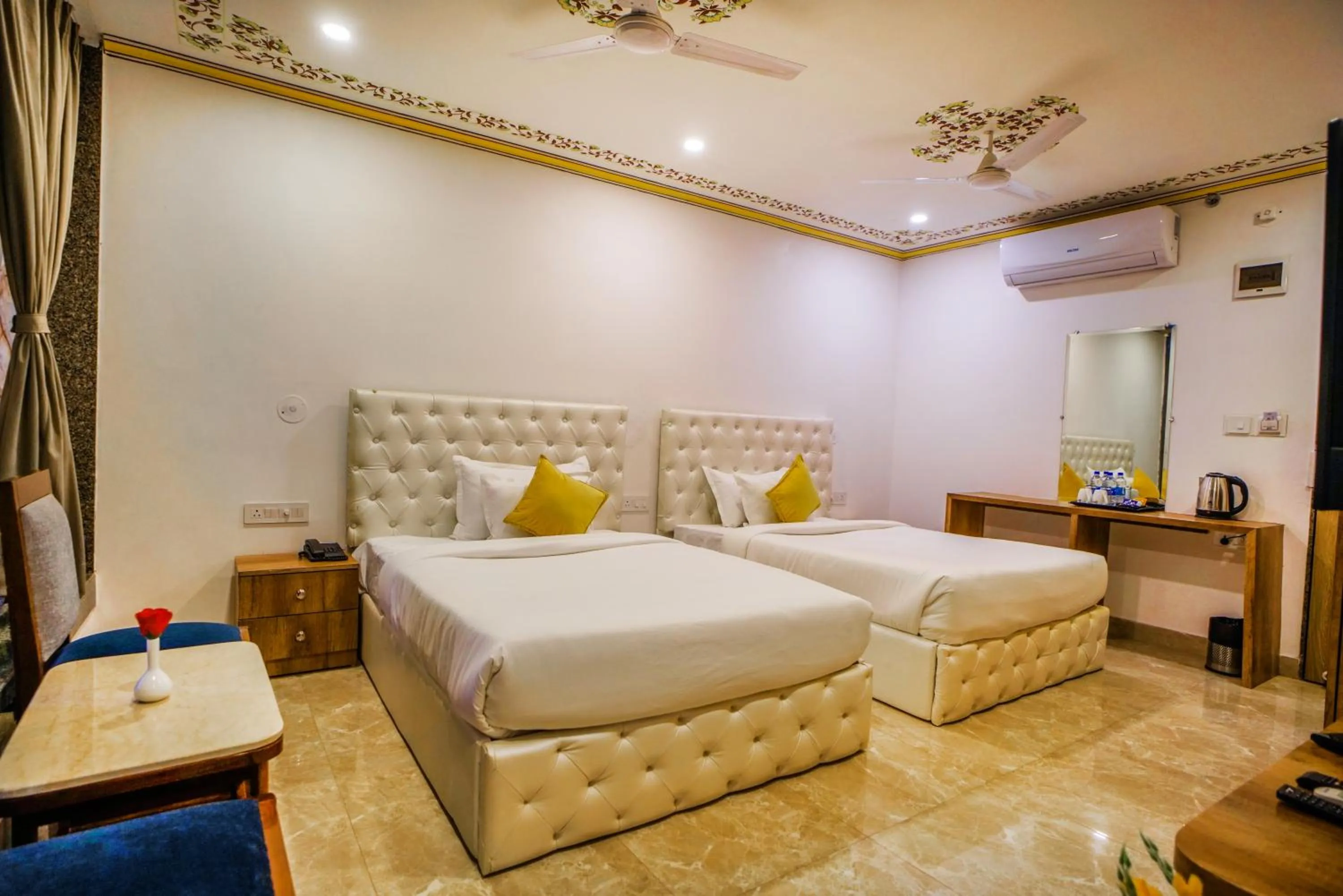 Living room, Bed in Pax Hotel Grand Blue 3 min walk from Udaipur city Railway Station
