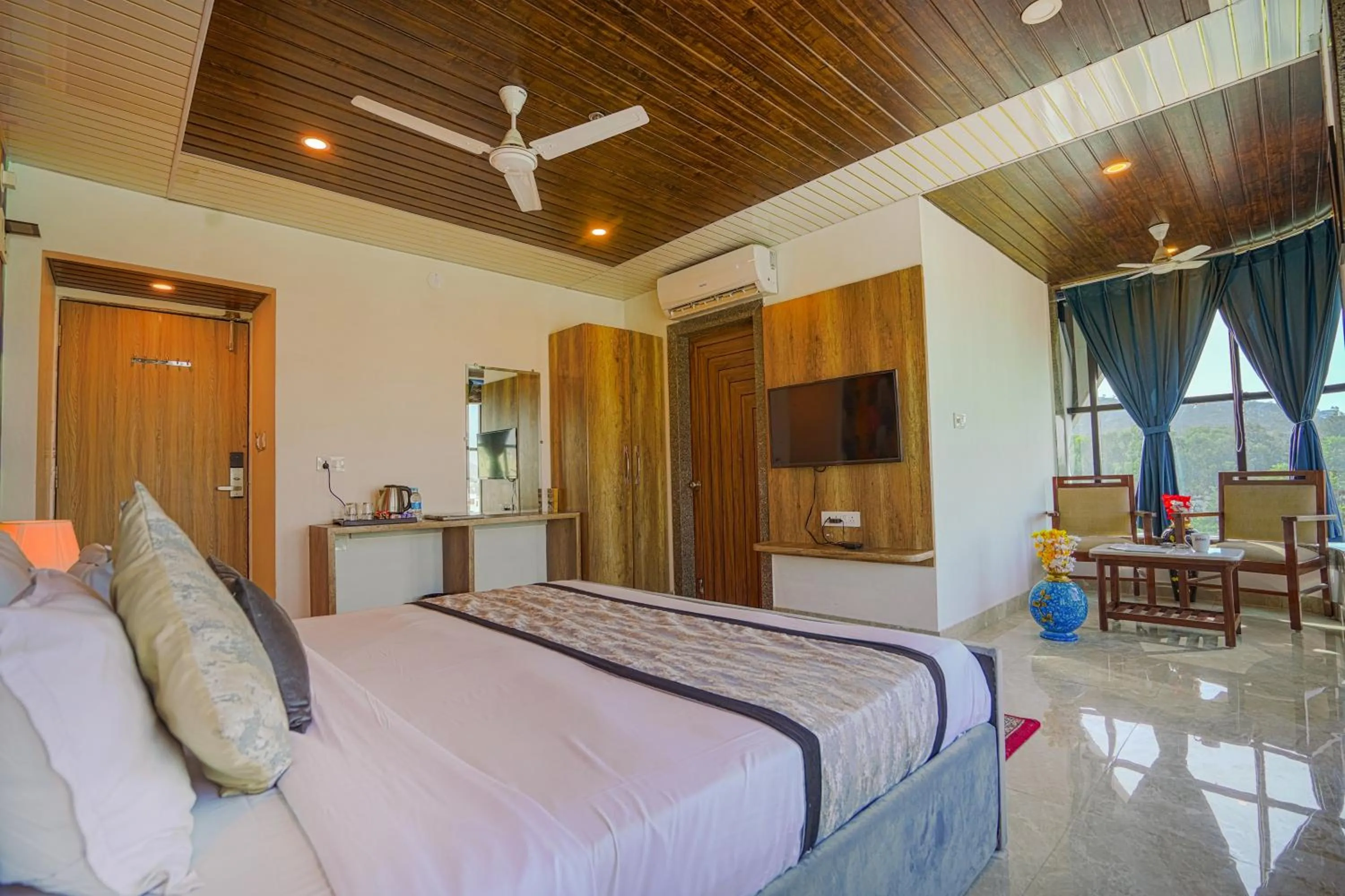 Bedroom, Bed in Pax Hotel Grand Blue 3 min walk from Udaipur city Railway Station