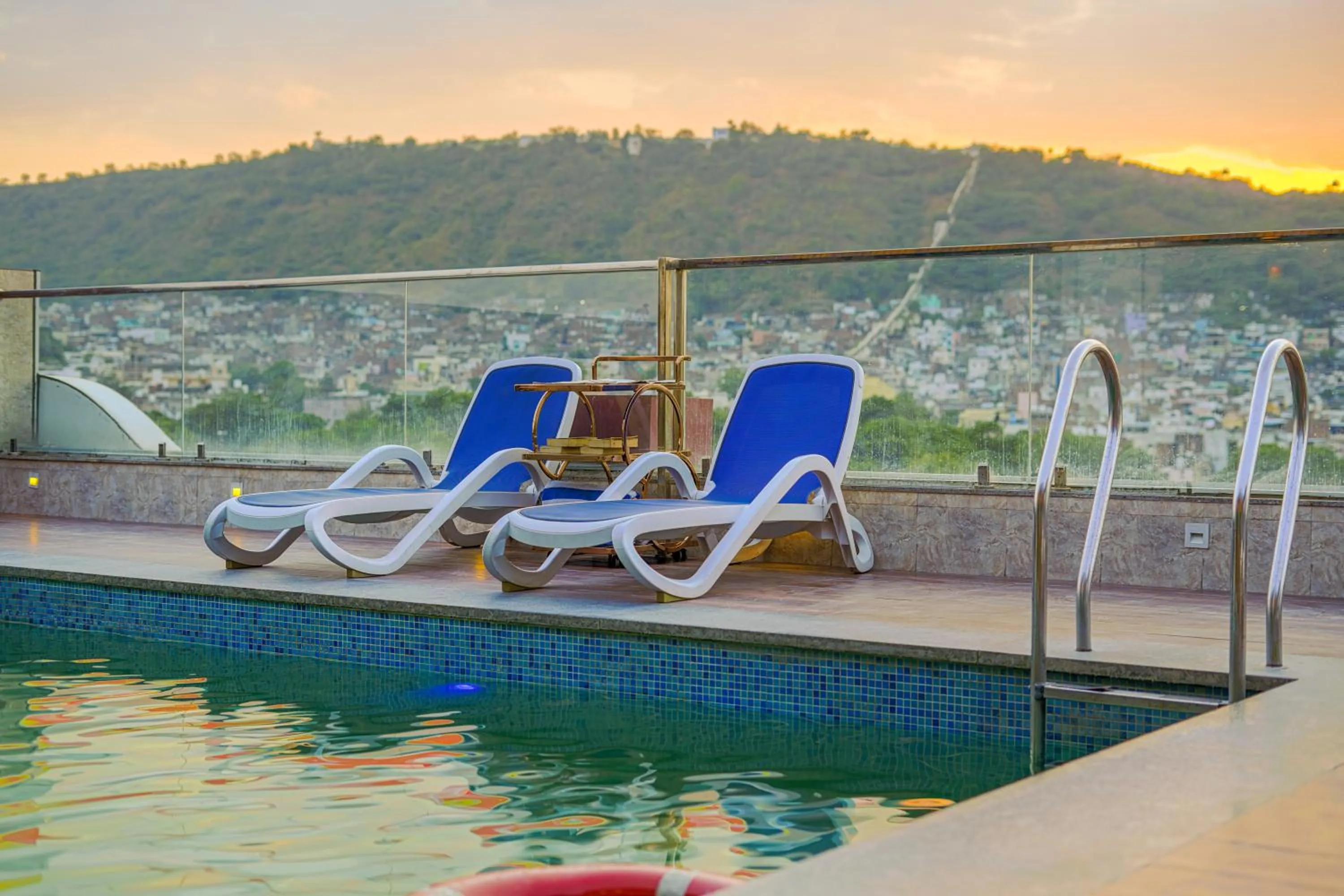 Swimming pool in Pax Hotel Grand Blue 3 min walk from Udaipur city Railway Station