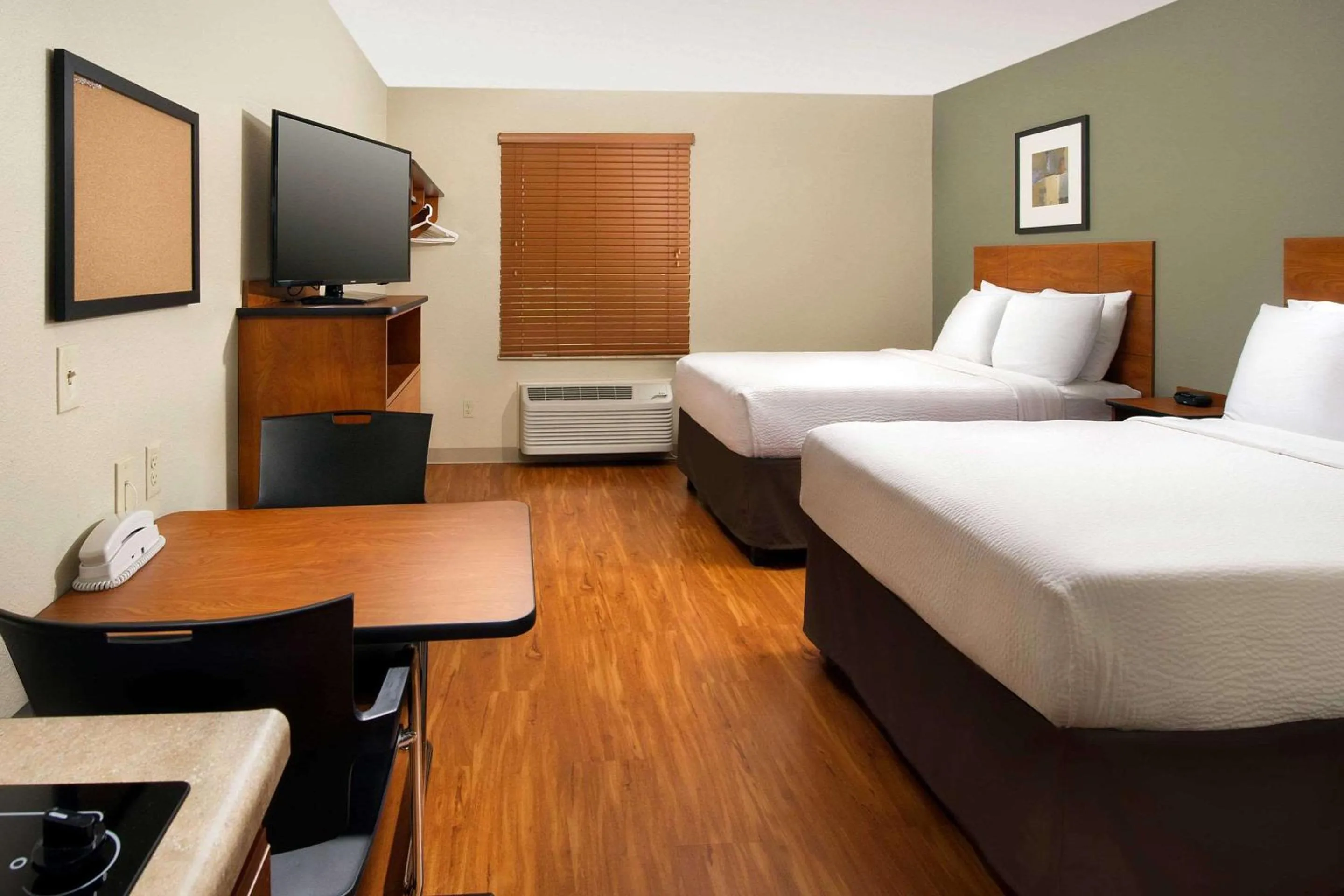 Bedroom, Bed in WoodSpring Suites Chicago Romeoville
