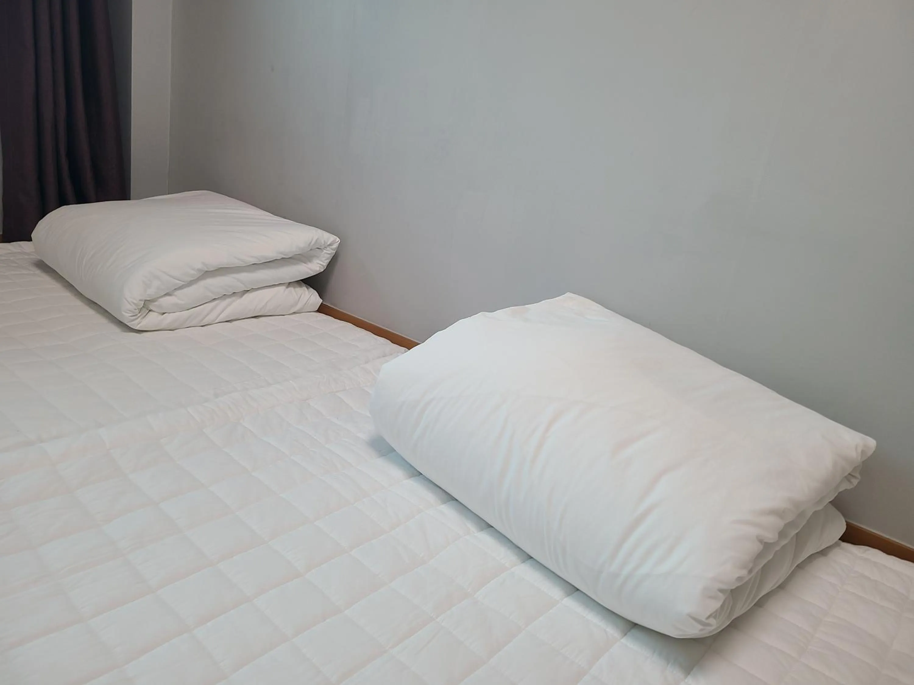 Bed in THE SOME PENSION