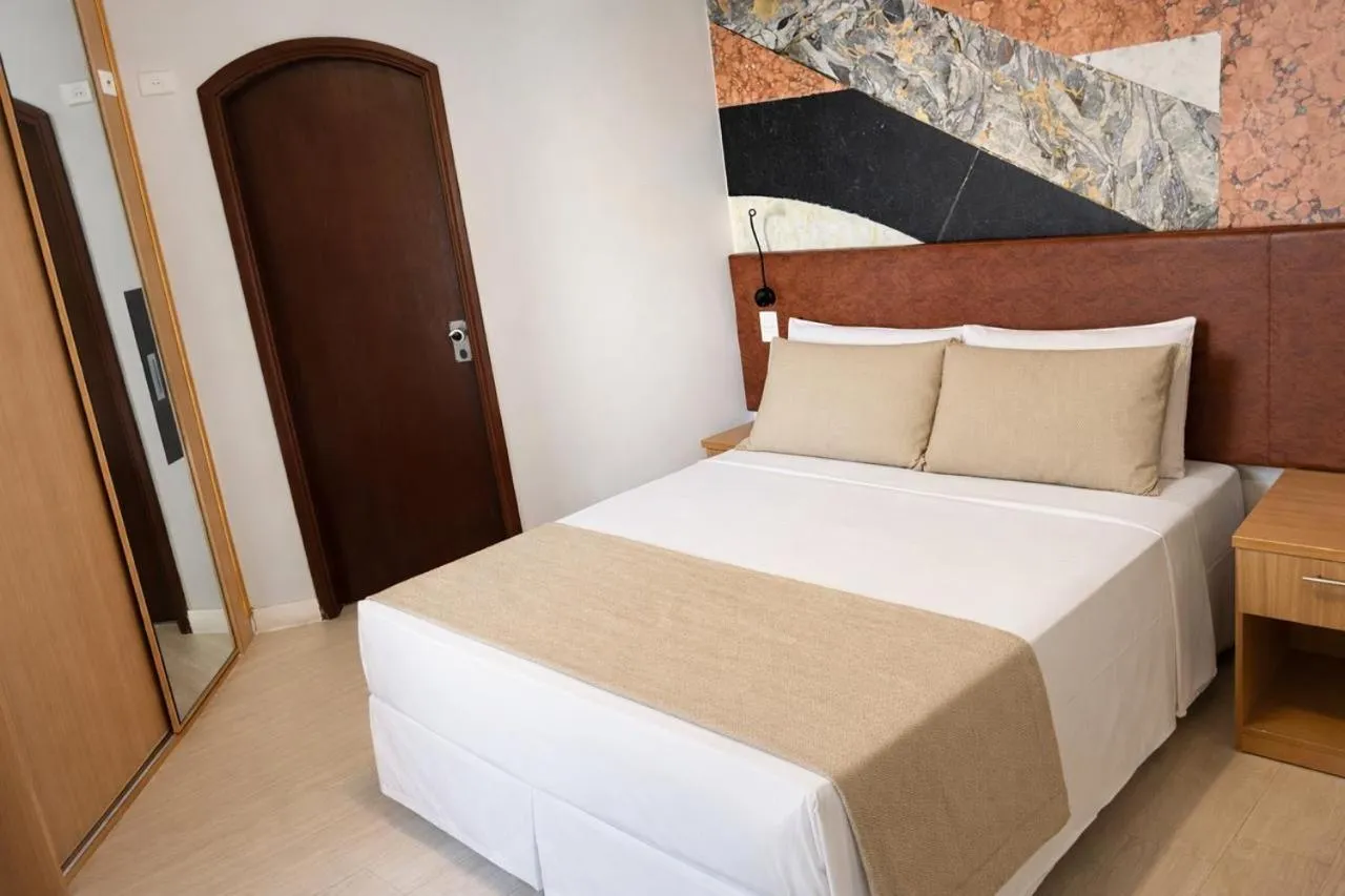 Photo of the whole room, Bed in Cosmopolitan Praia Flat