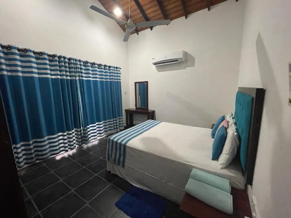 Bed in Reef Bungalow Hotel