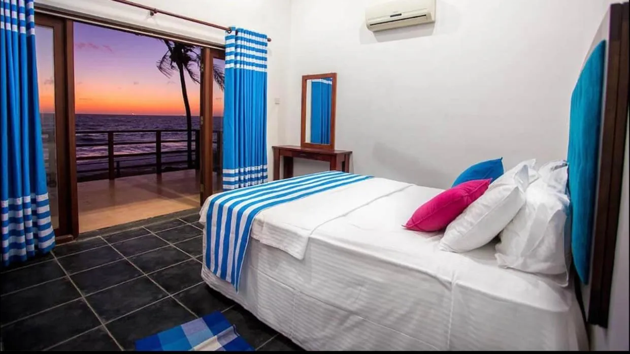 Bed in Reef Bungalow Hotel