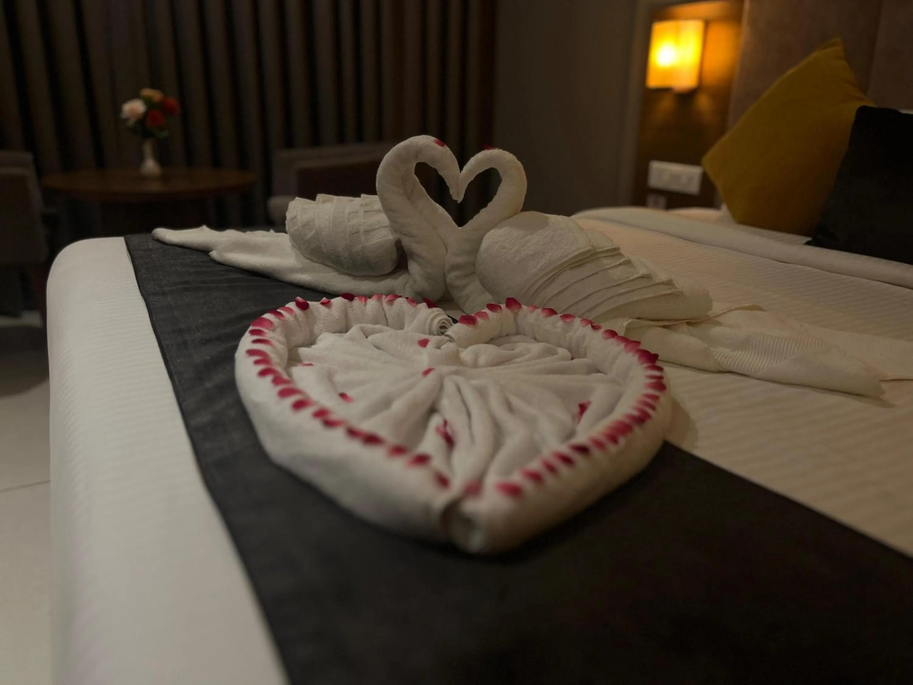 Bed in Hotel Kottayam Grand