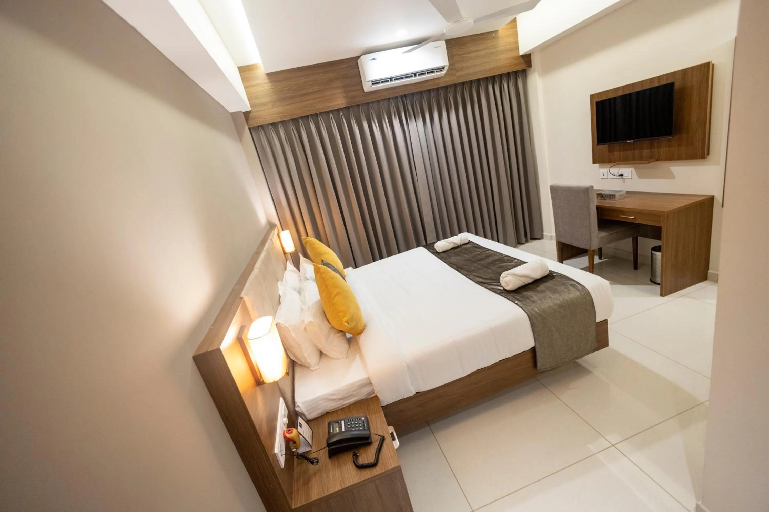 Bed in Hotel Kottayam Grand