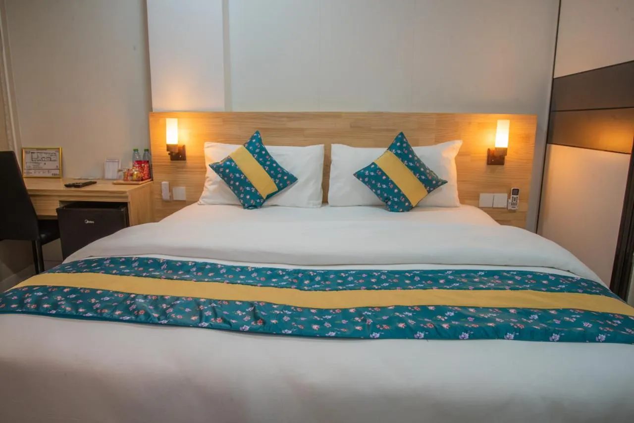 Bed in Tourist Inn Grand