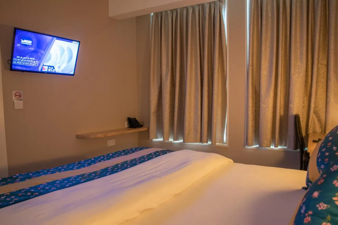 Bed in Tourist Inn Grand