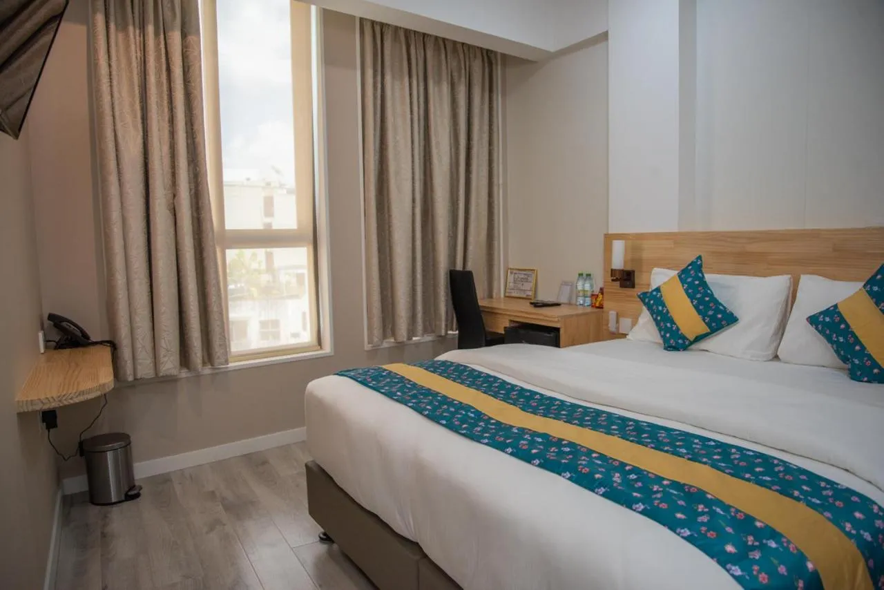 Bed in Tourist Inn Grand