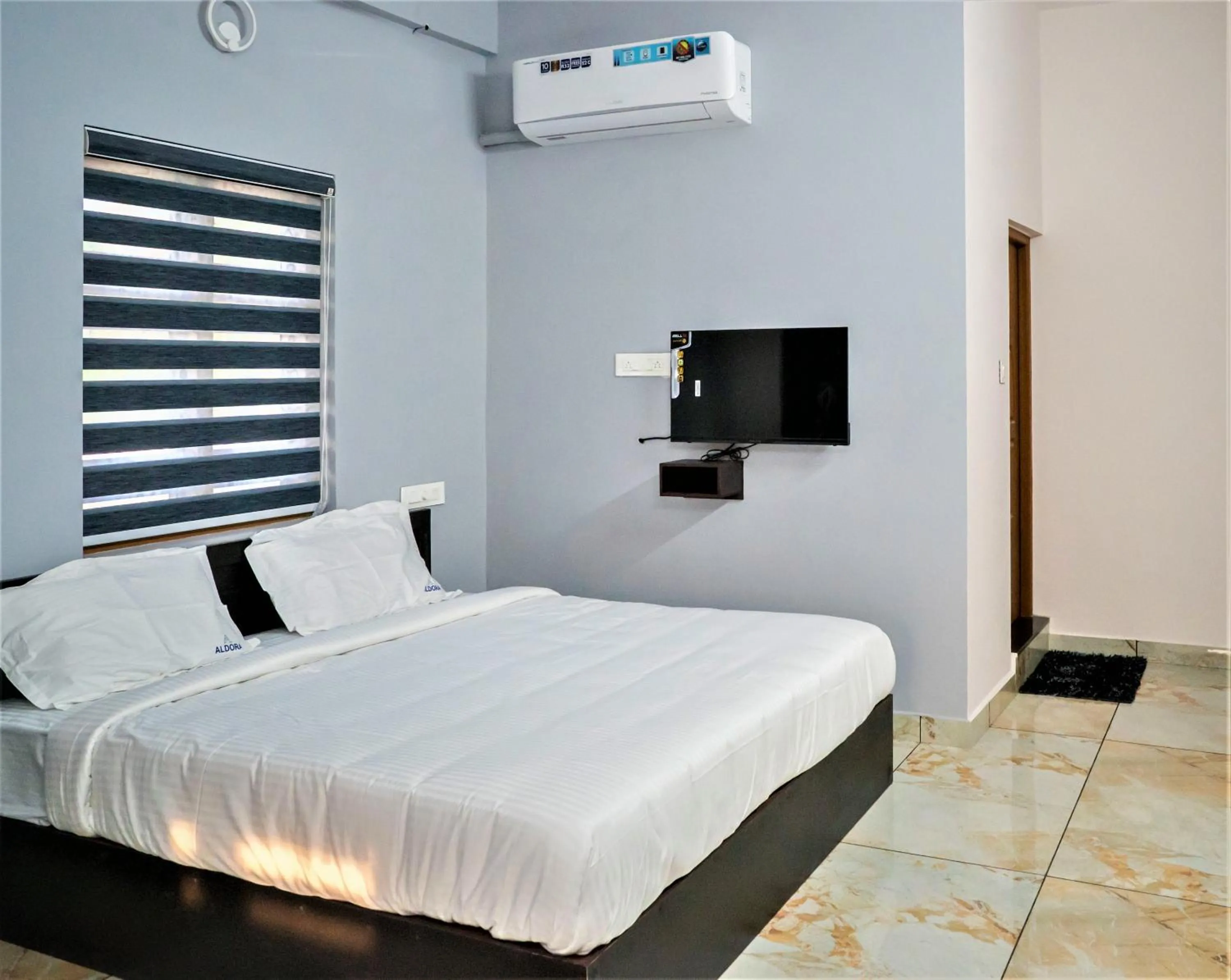 Bed in Aldora Airport Residency