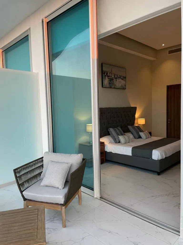 Seating area, Bed in Maritima Front Beach Apartment