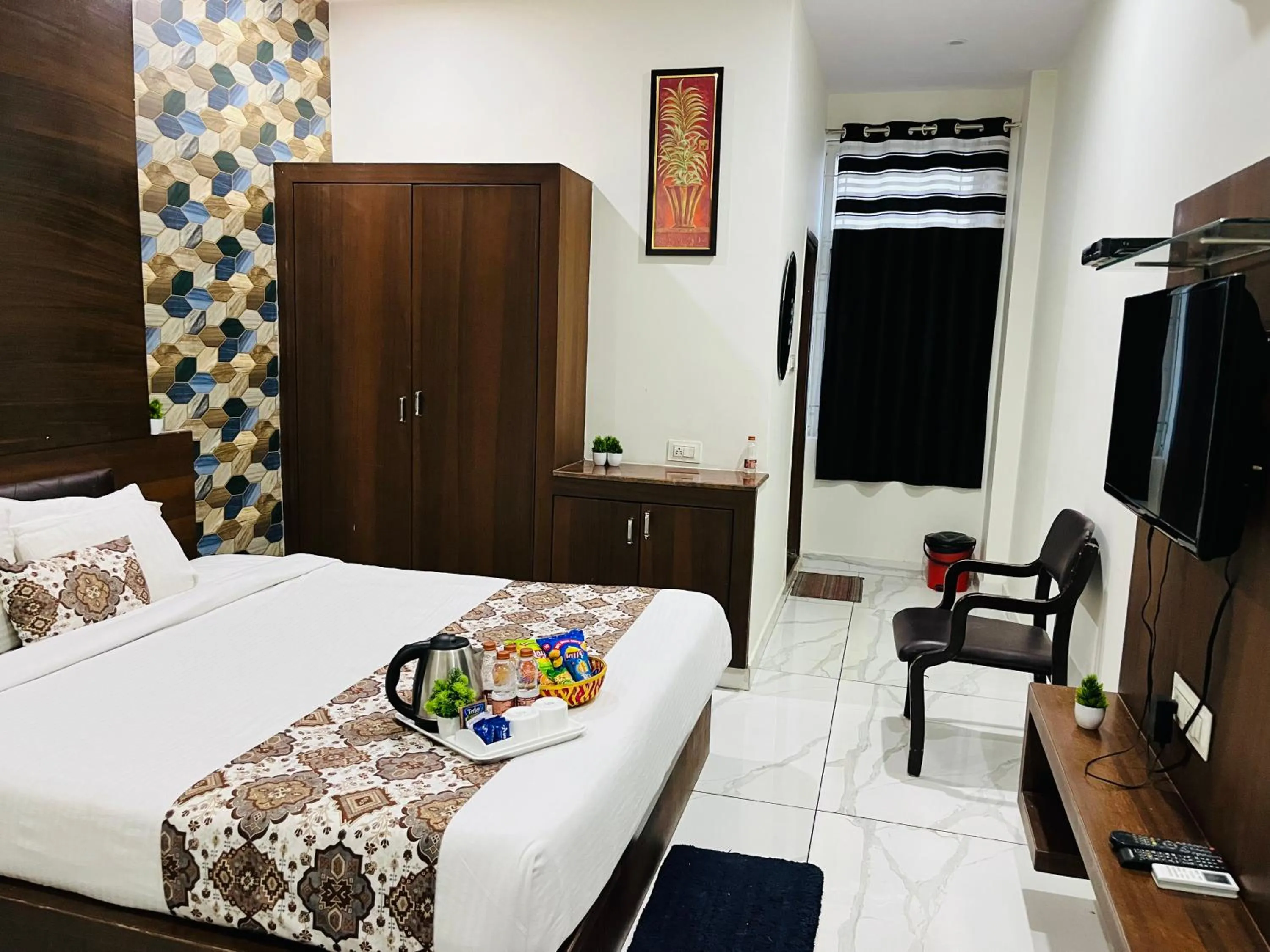 Communal lounge/ TV room, Bed in Hotel Plaza Hyderabad Airport Zone