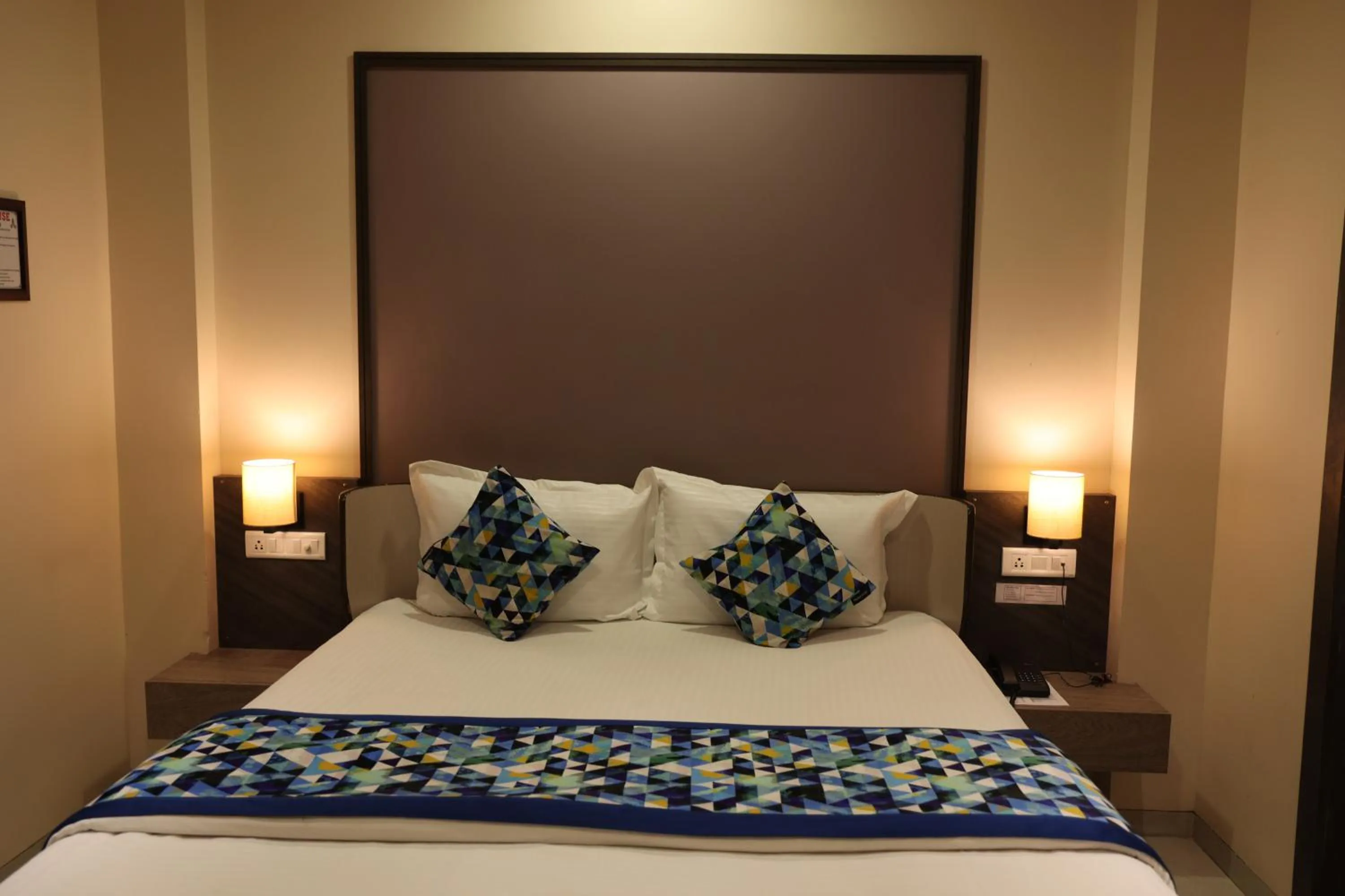 Bed in Hotel Pinaka Inn