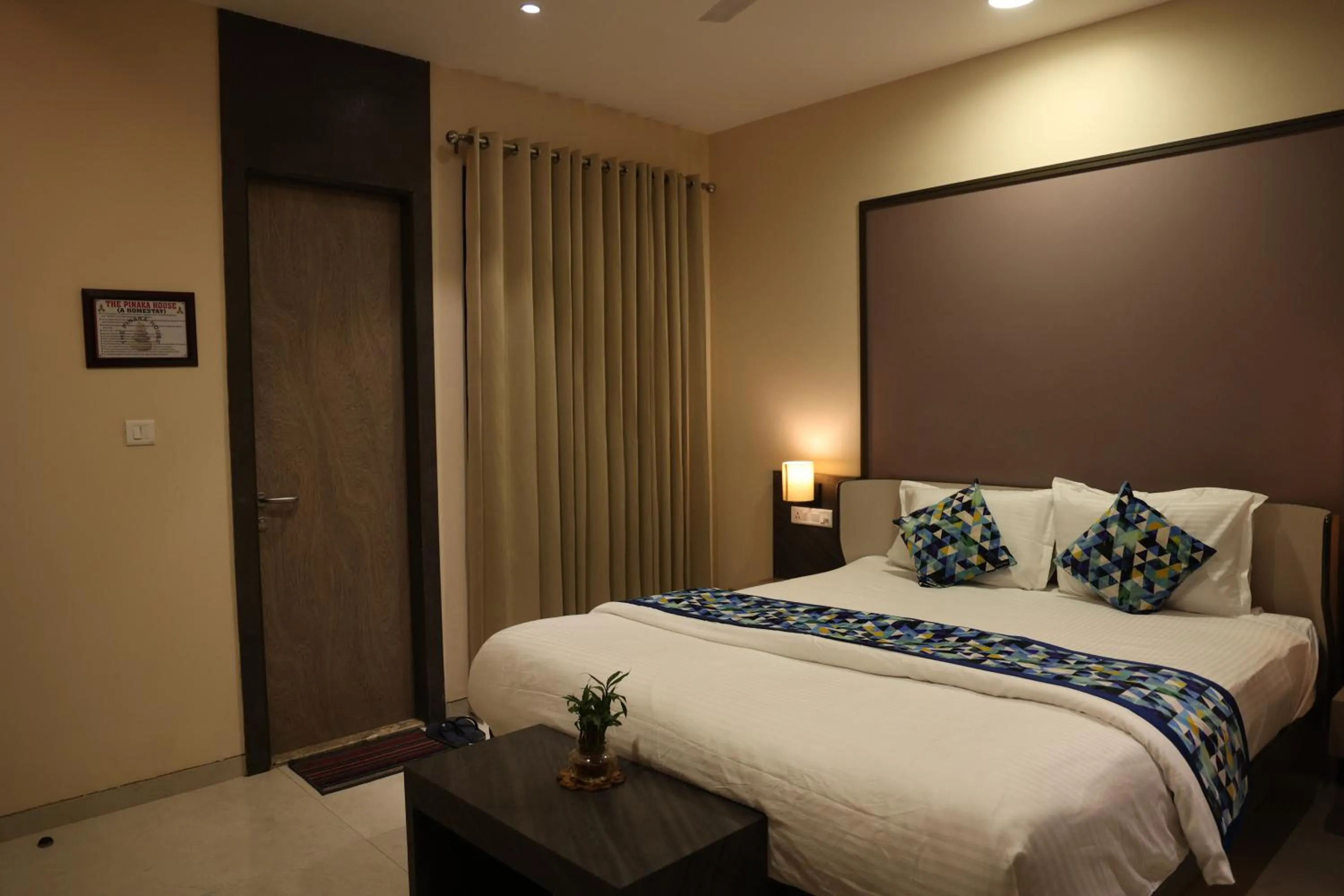 Bed in Hotel Pinaka Inn