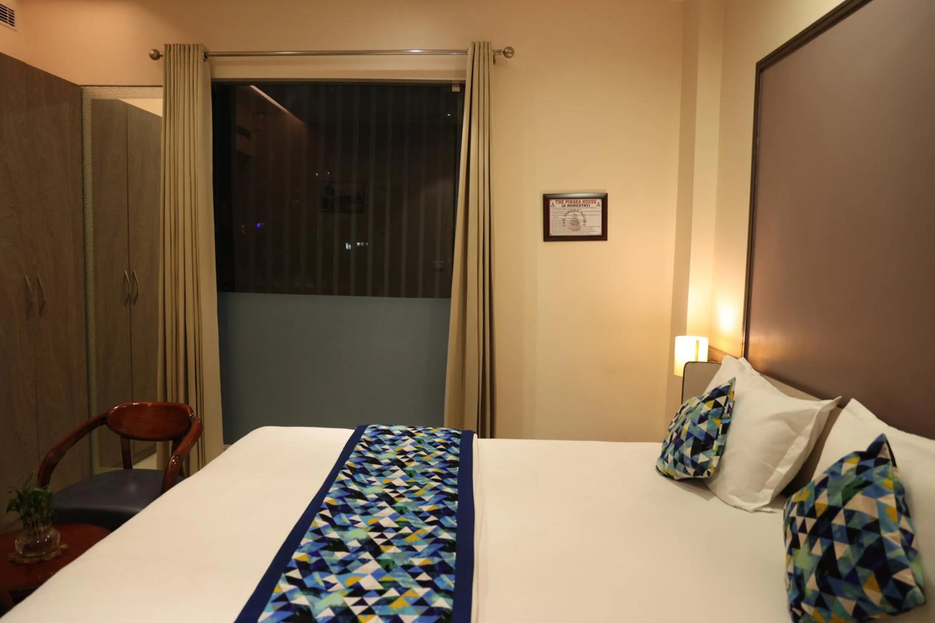 Bed in Hotel Pinaka Inn