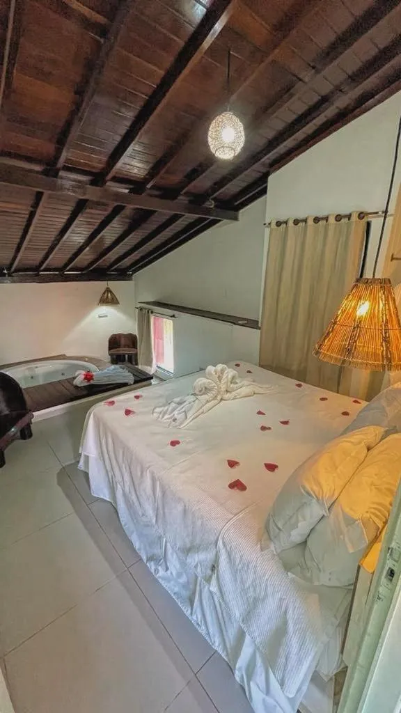 Bed in Pousada Paradise