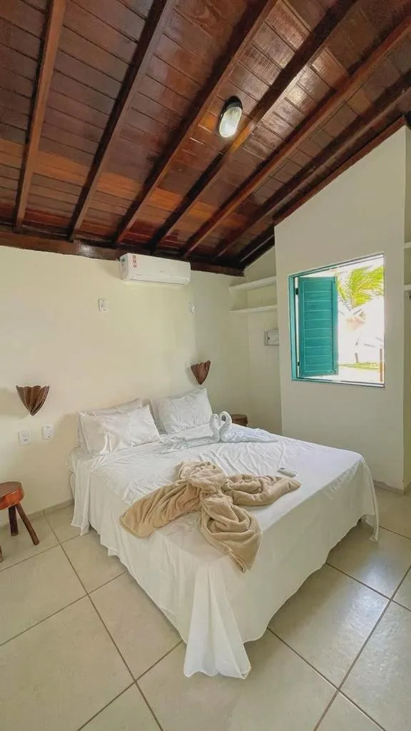 Bed in Pousada Paradise