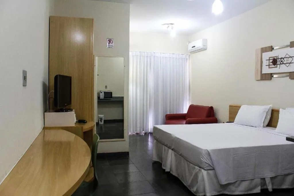 Bed in Bravo Suites São Carlos