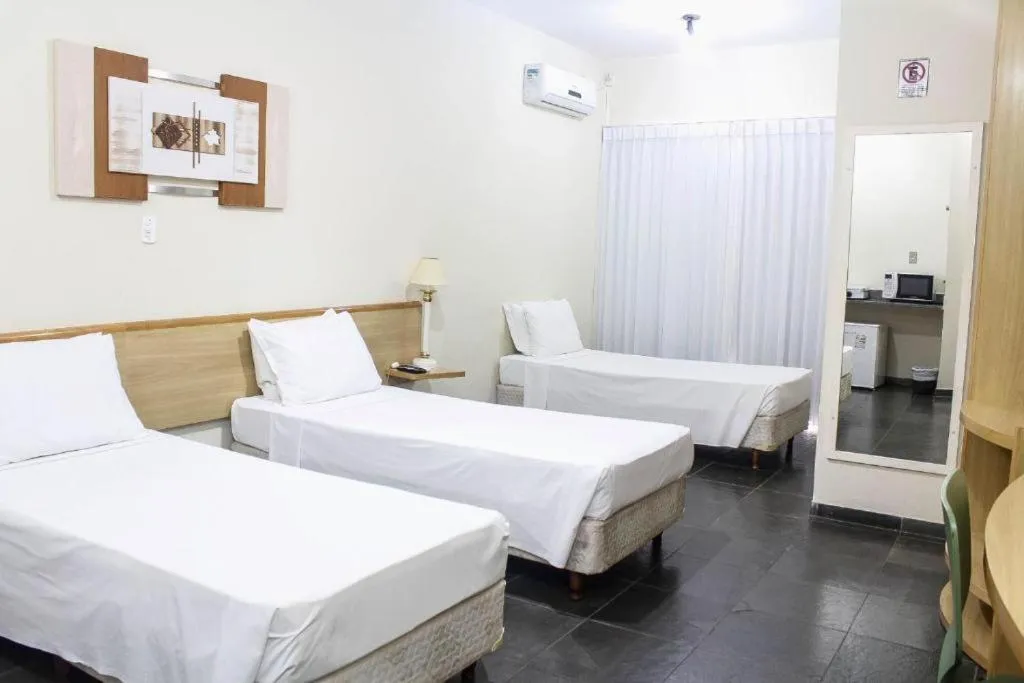 Bed in Bravo Suites São Carlos