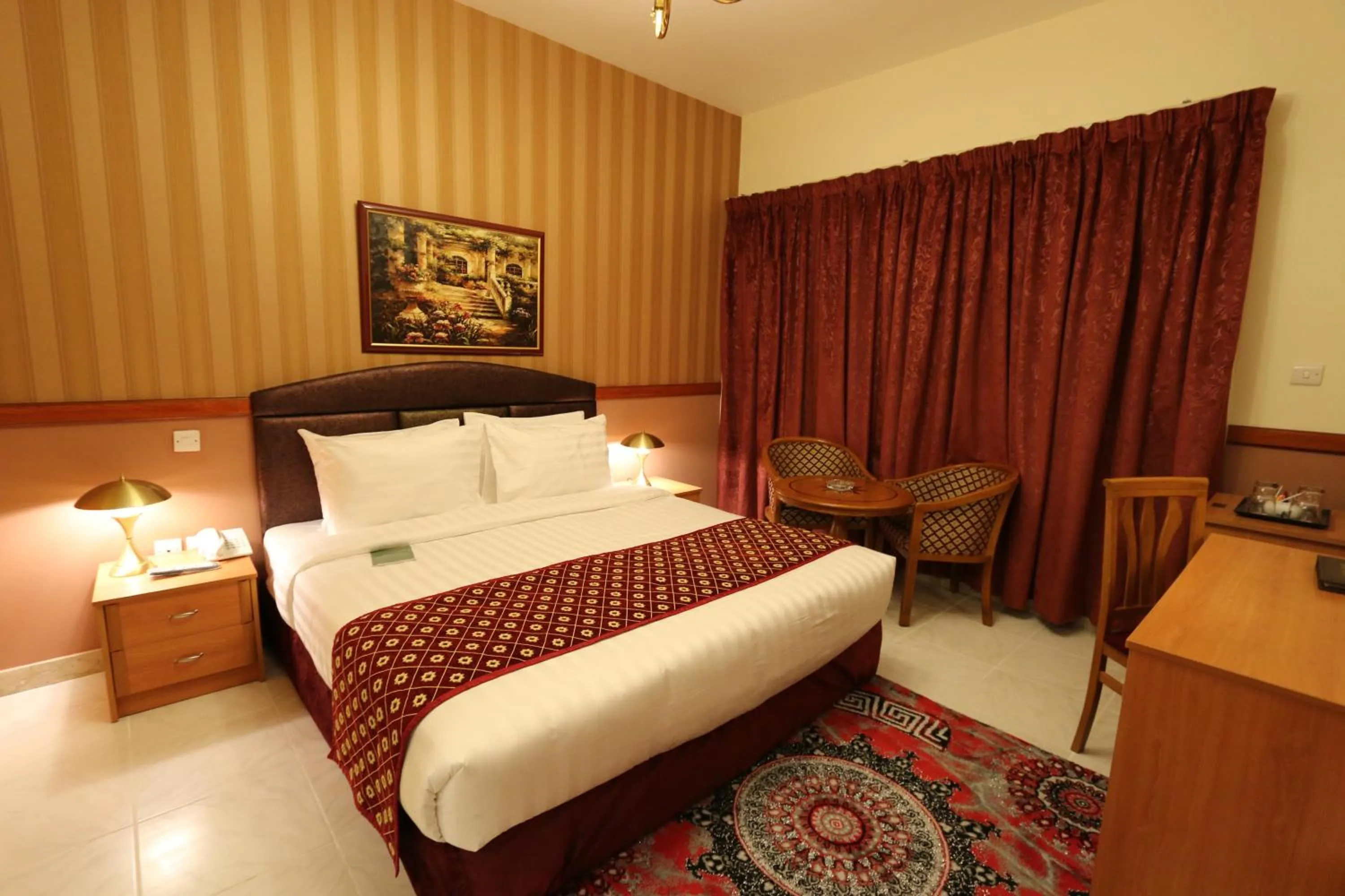 Bed in NEW CALIFORNIA HOTEL