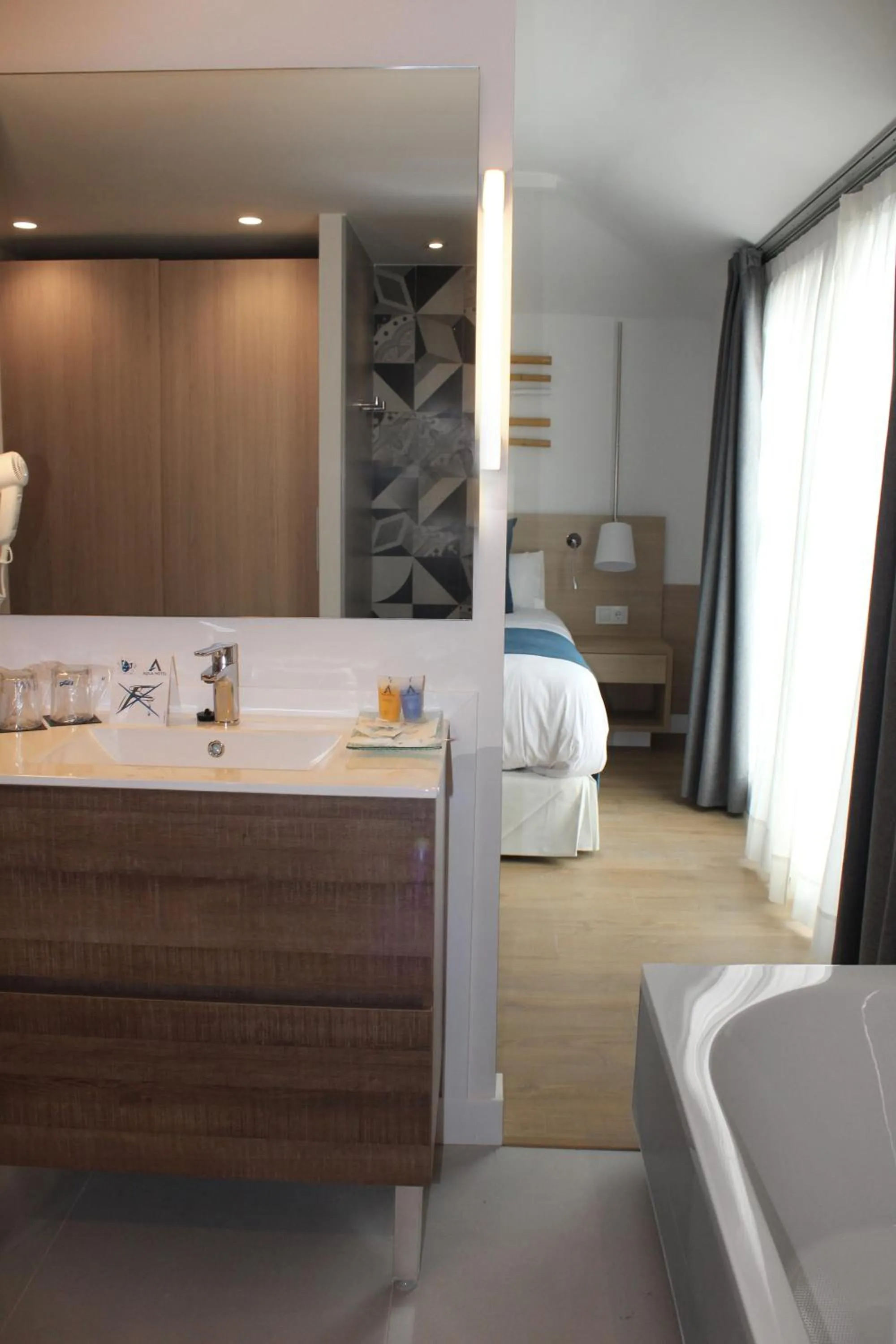 Bathroom, Bed in AQUA Hotel Onabrava & Spa 4*Sup