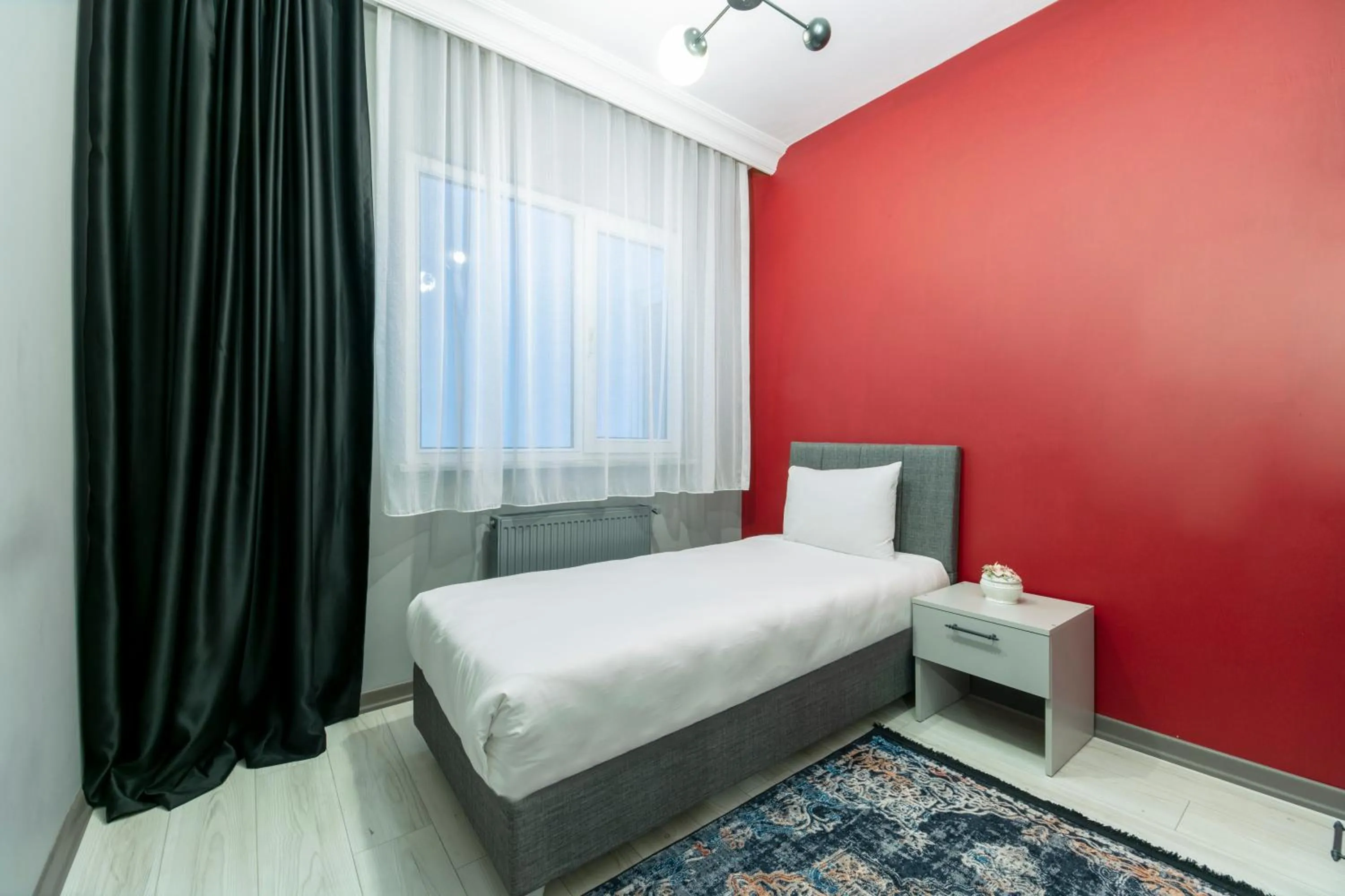 Bed in Hexa Suites Hotel