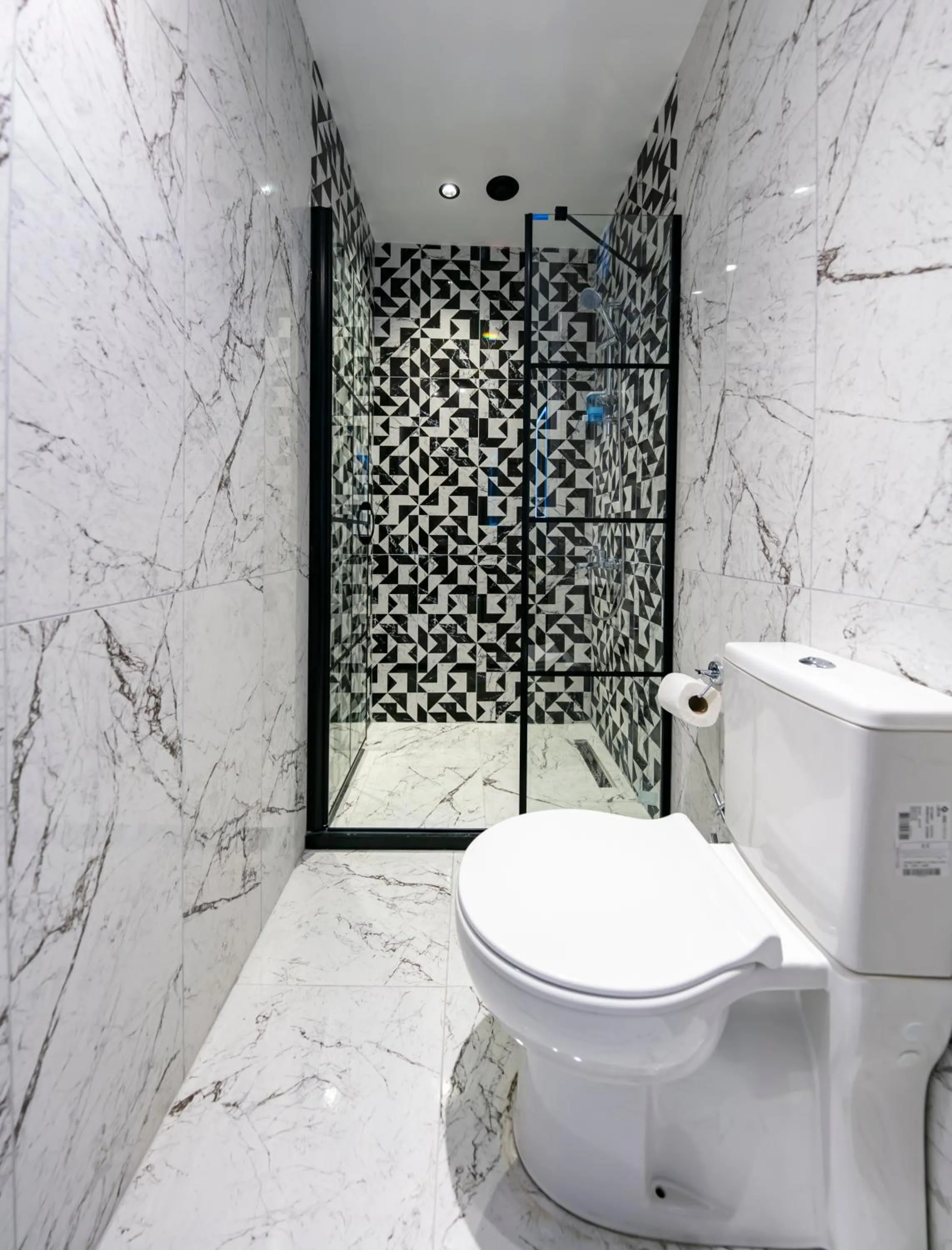 Toilet in Hexa Suites Hotel