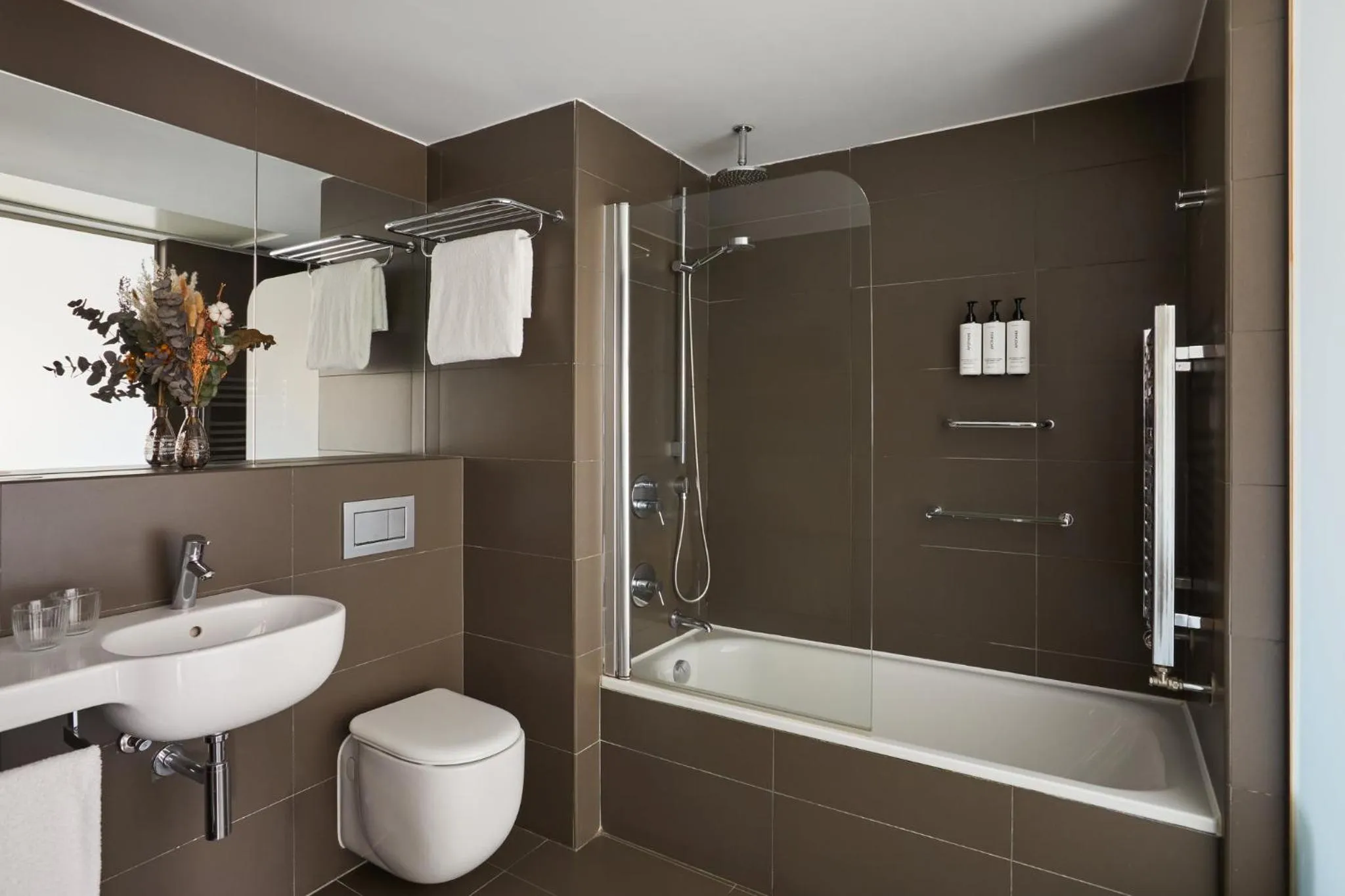 Bathroom in voco Madrid Retiro by IHG