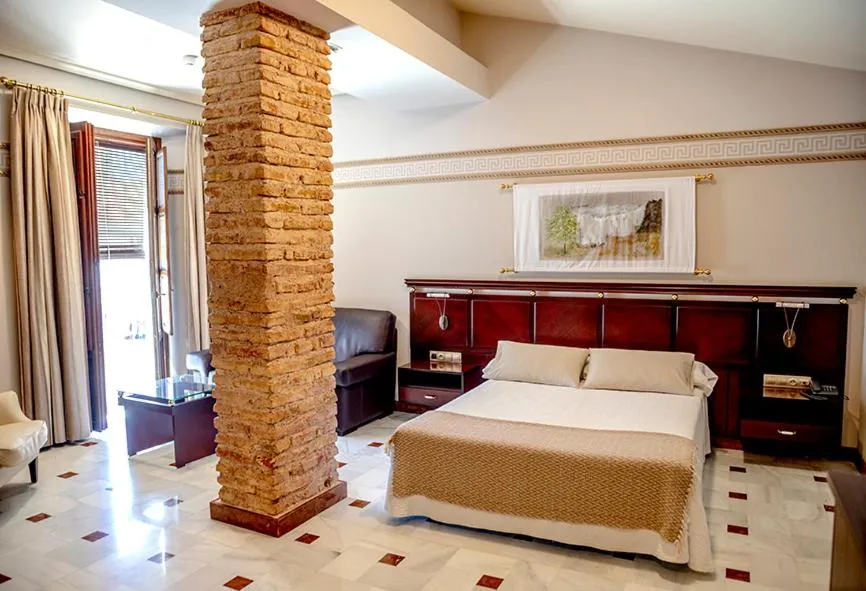 Bed in Hotel Don Miguel Plaza