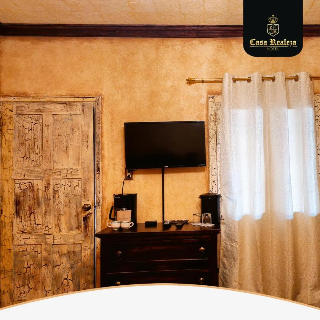 Communal lounge/ TV room, Bed in Hotel Casa Realeza