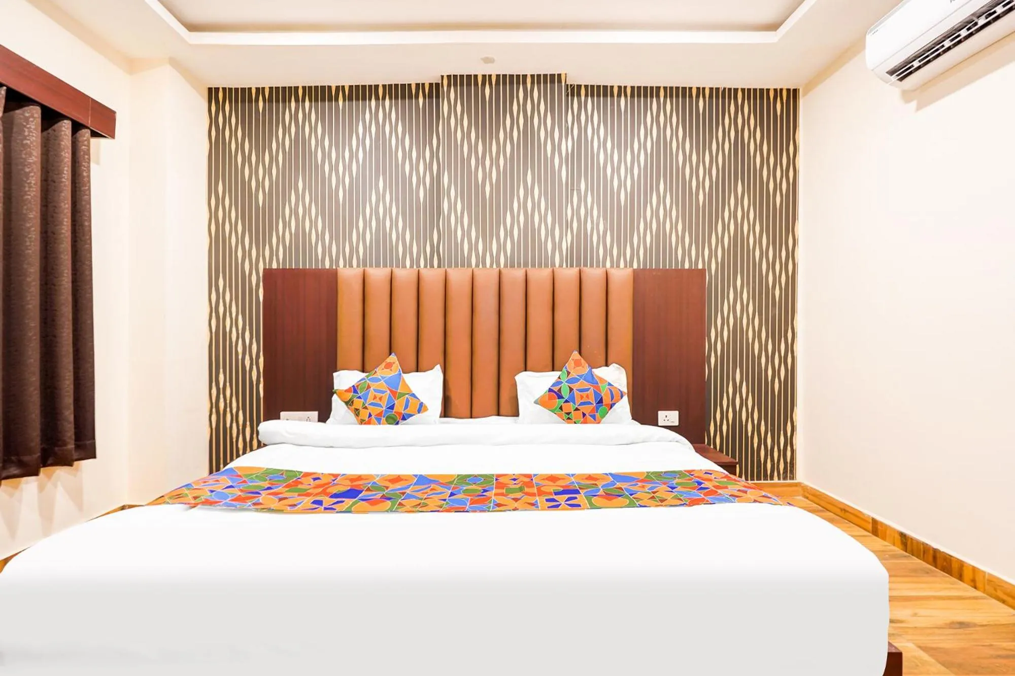 Bed in FabHotel Palm Bliss