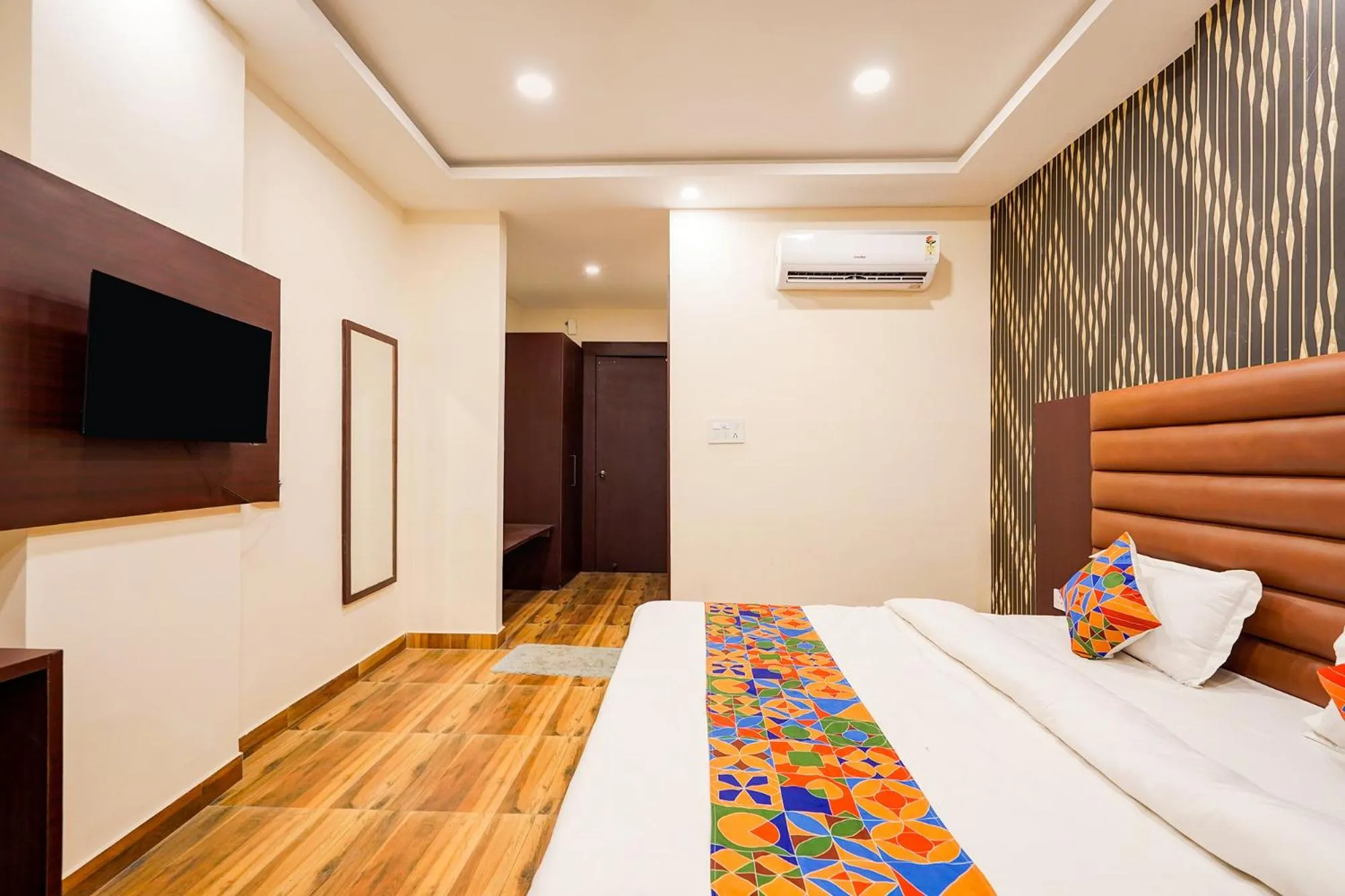 Bed in FabHotel Palm Bliss