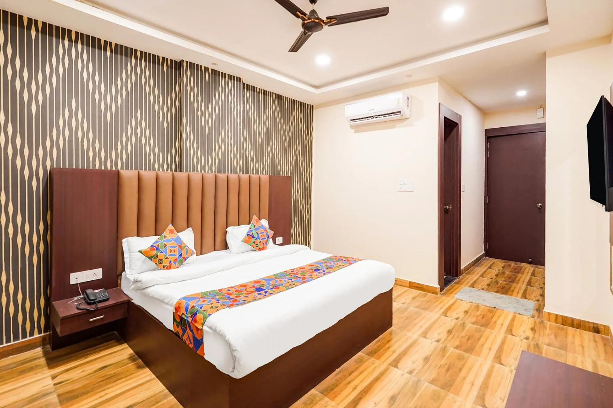 Bed in FabHotel Palm Bliss