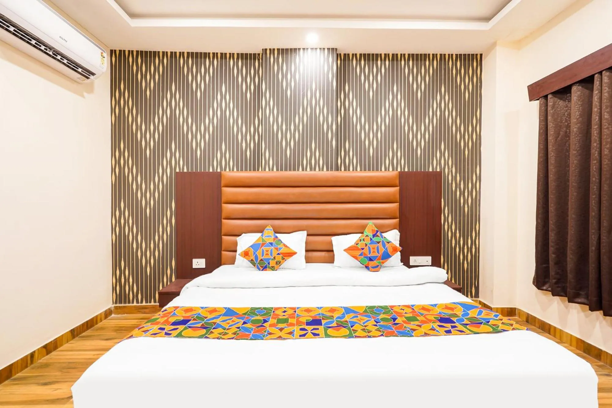 Bed in FabHotel Palm Bliss