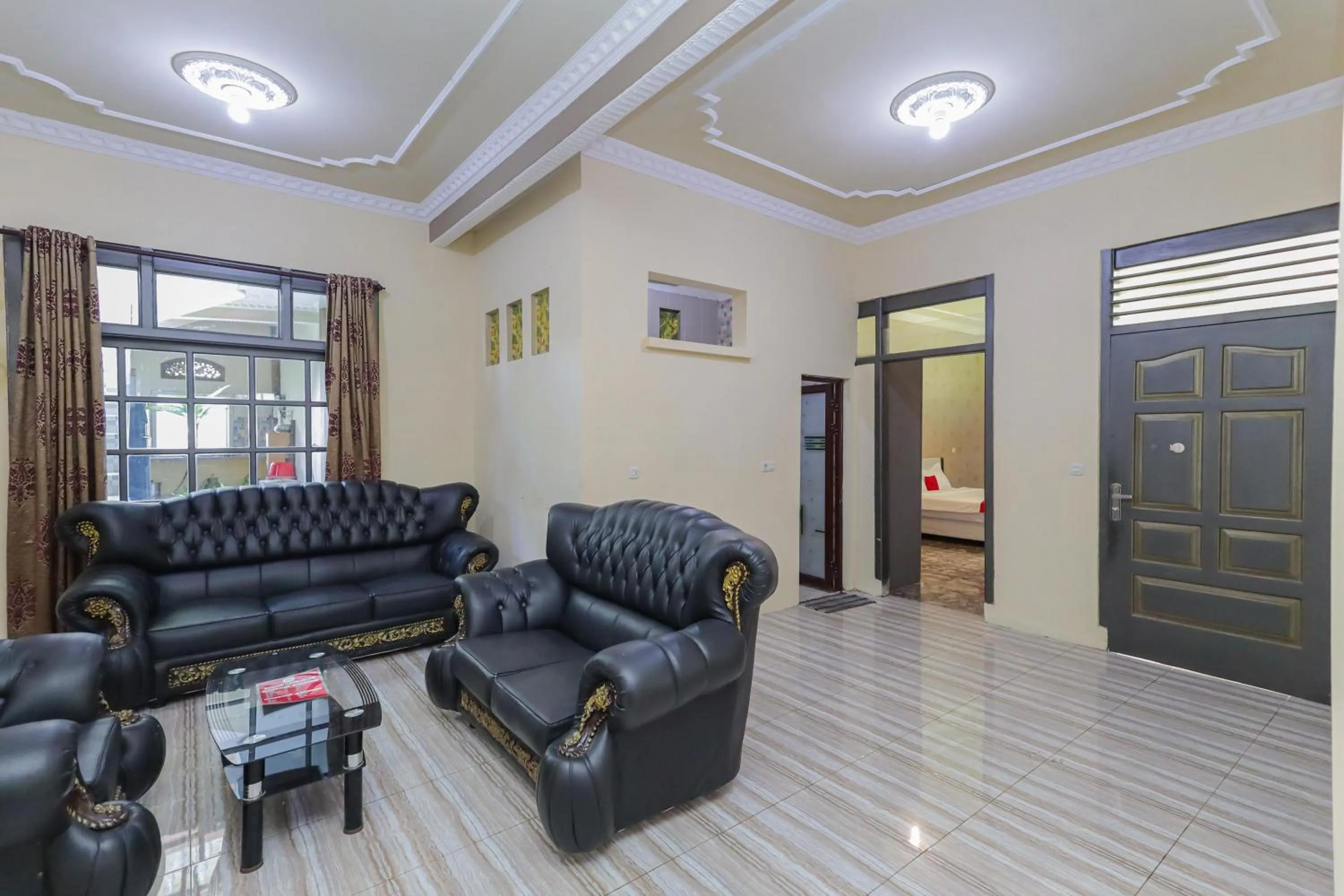 Living room in RedDoorz Plus @ Villa Bontes Batu