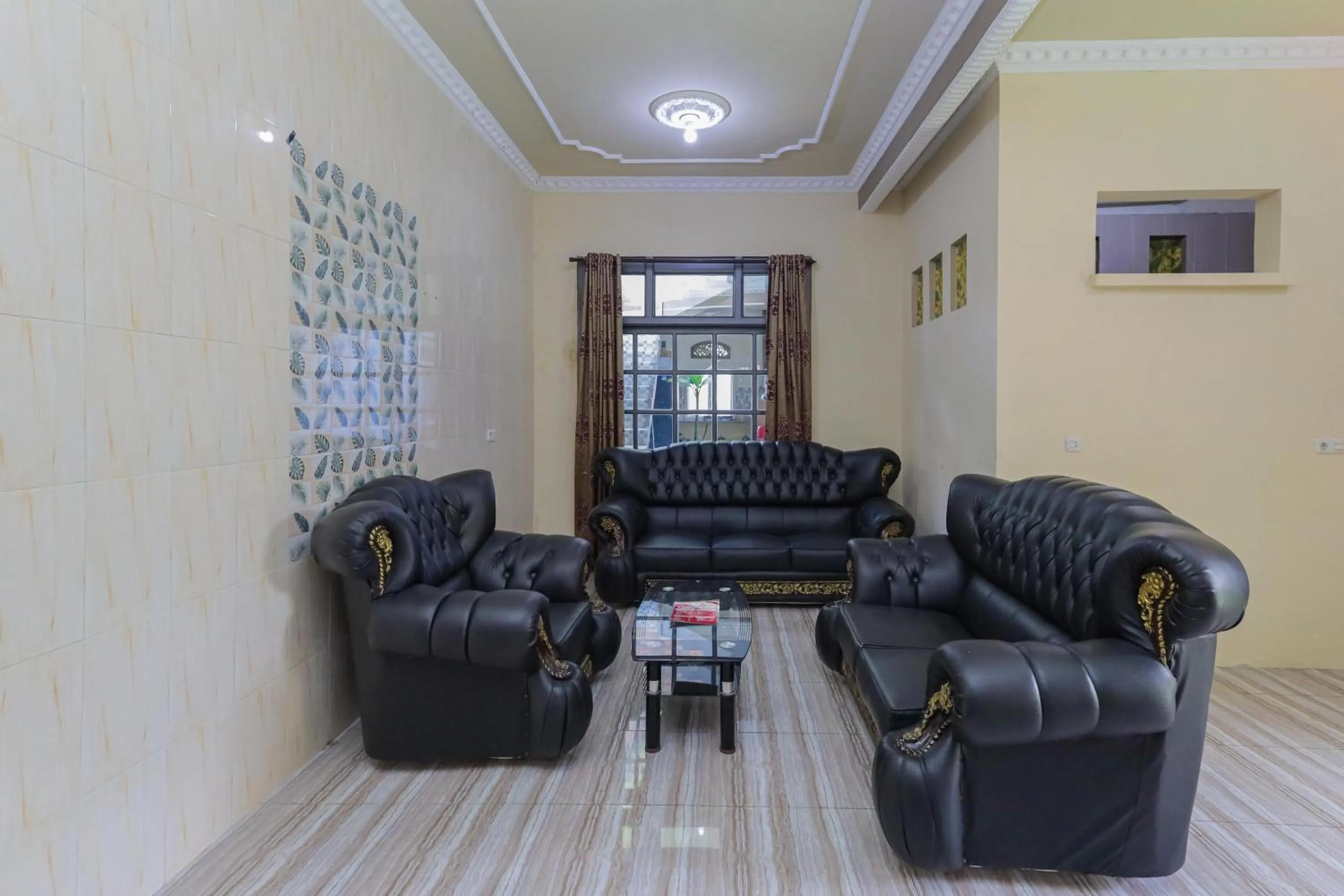 Living room in RedDoorz Plus @ Villa Bontes Batu