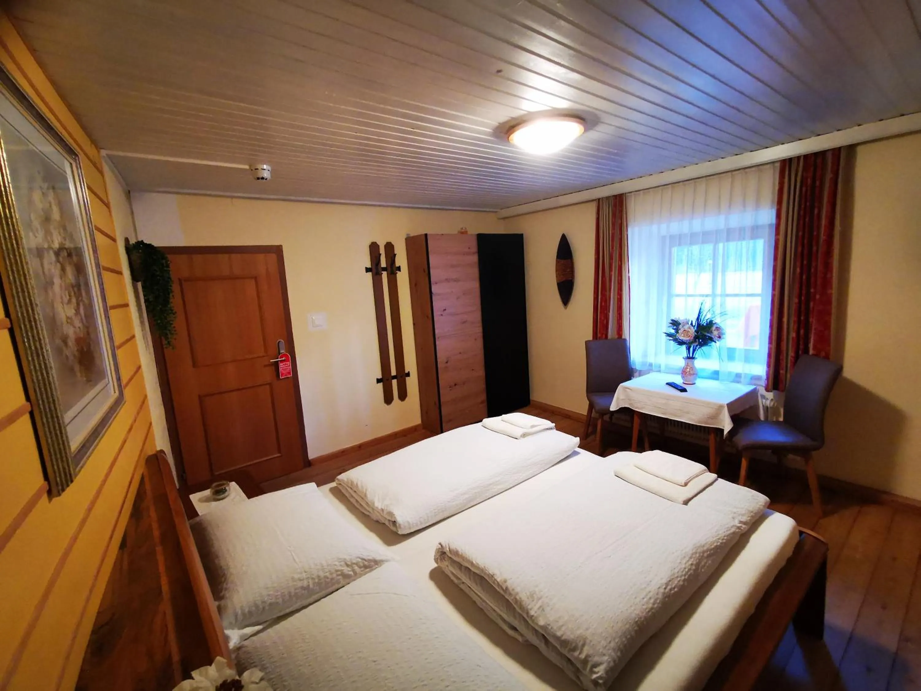 Photo of the whole room, Bed in Gasthof Geronimo