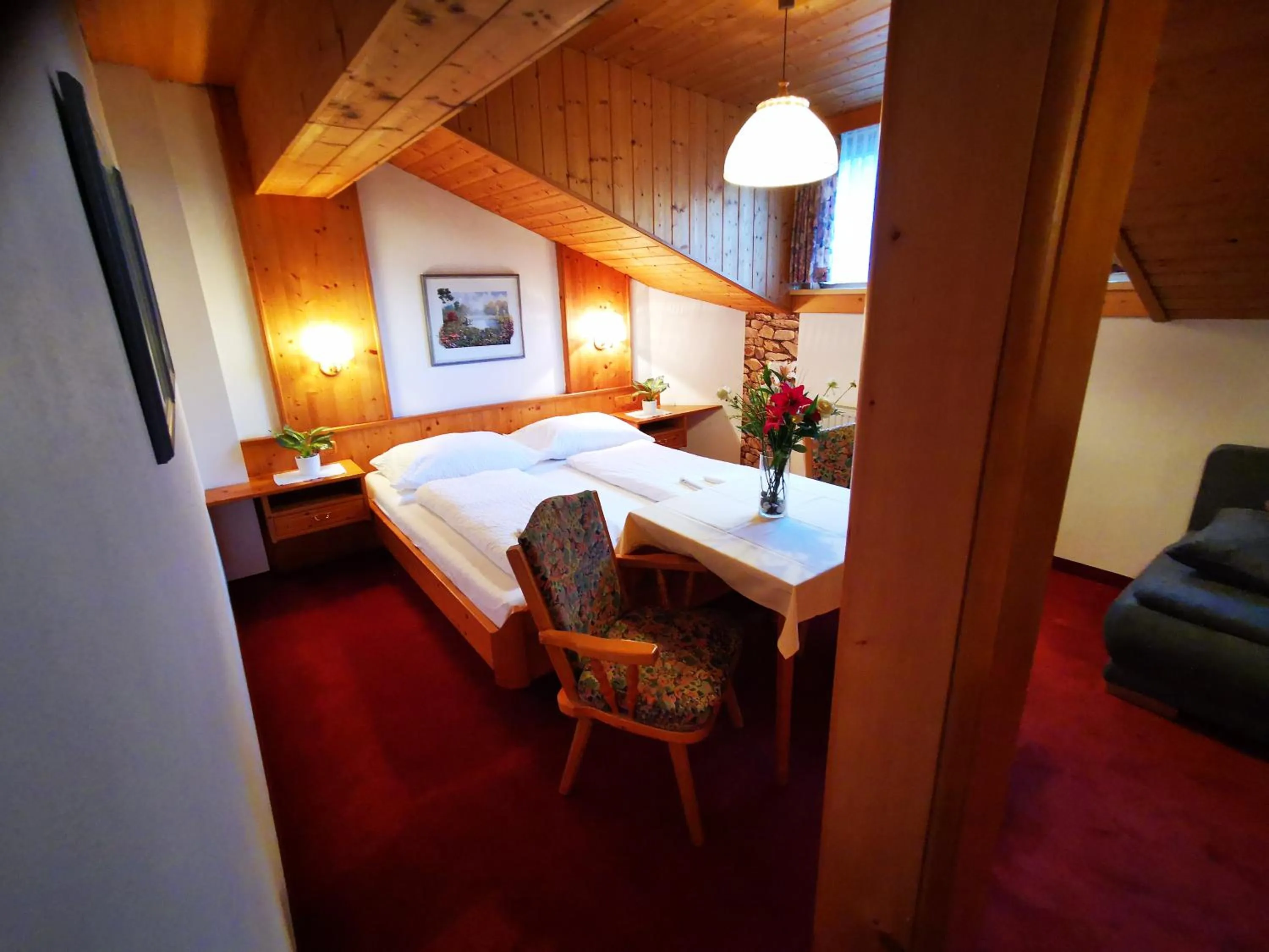 Photo of the whole room, Bed in Gasthof Geronimo