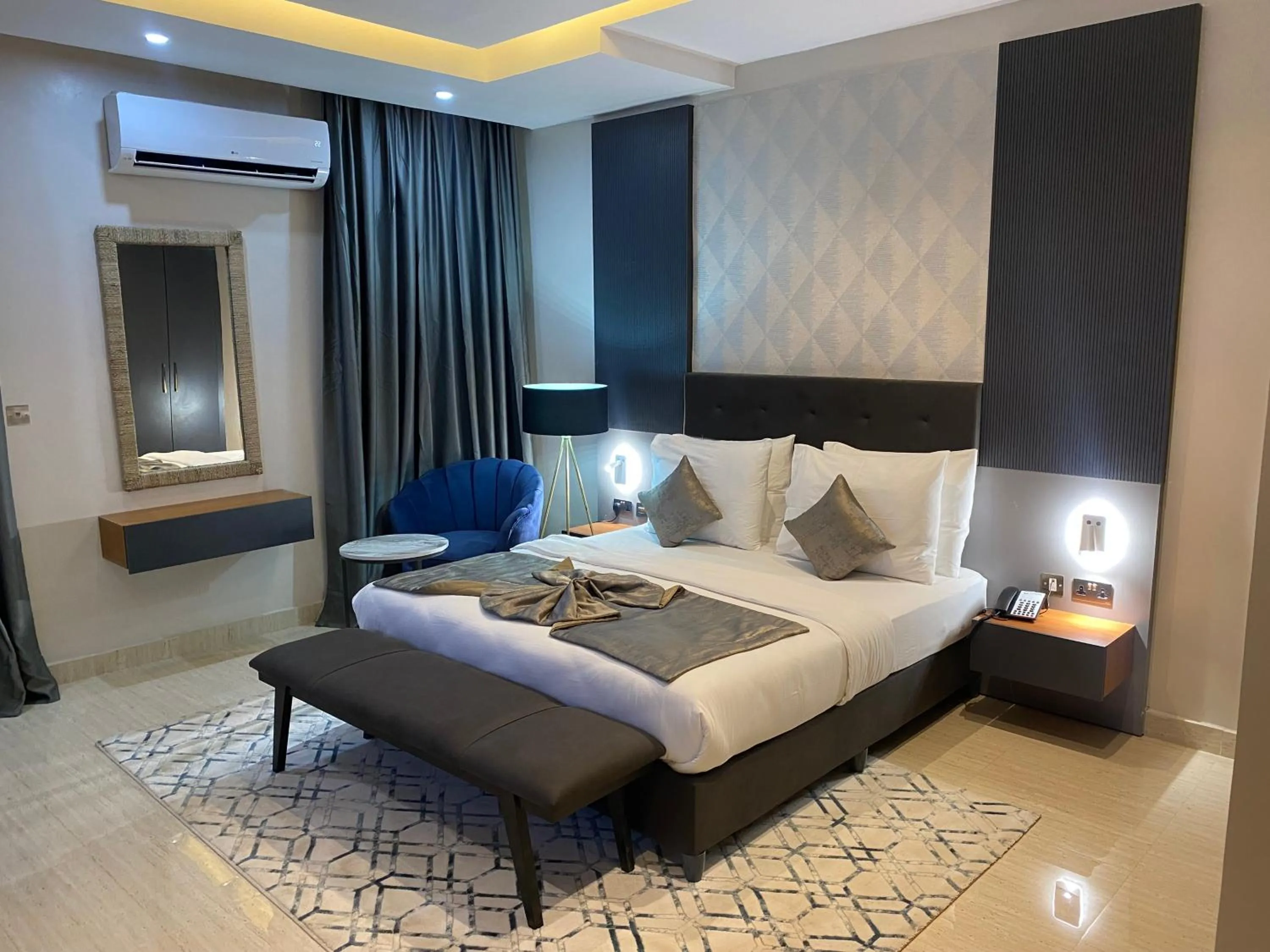 Bed in Wali's Suites