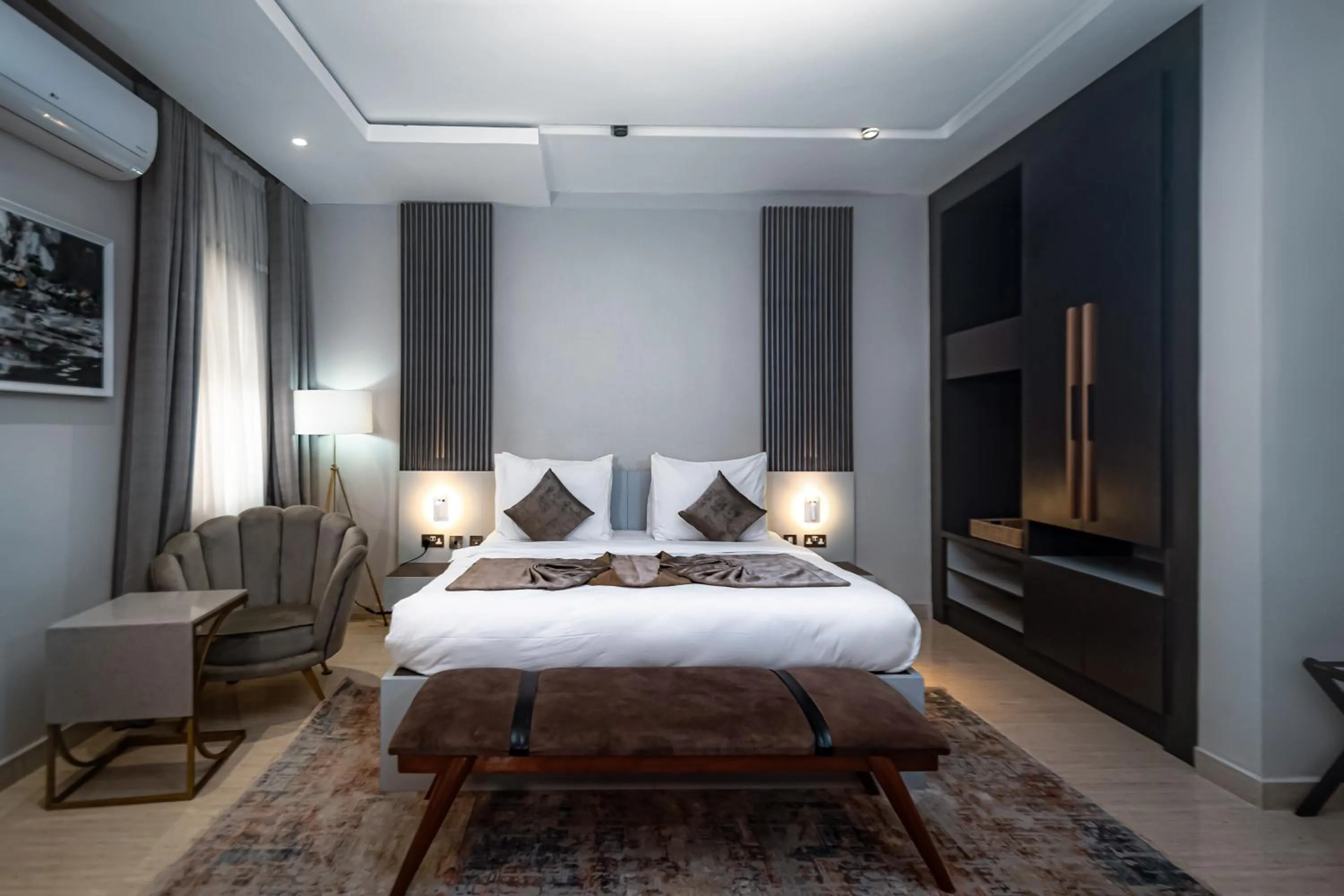 Bed in Wali's Suites