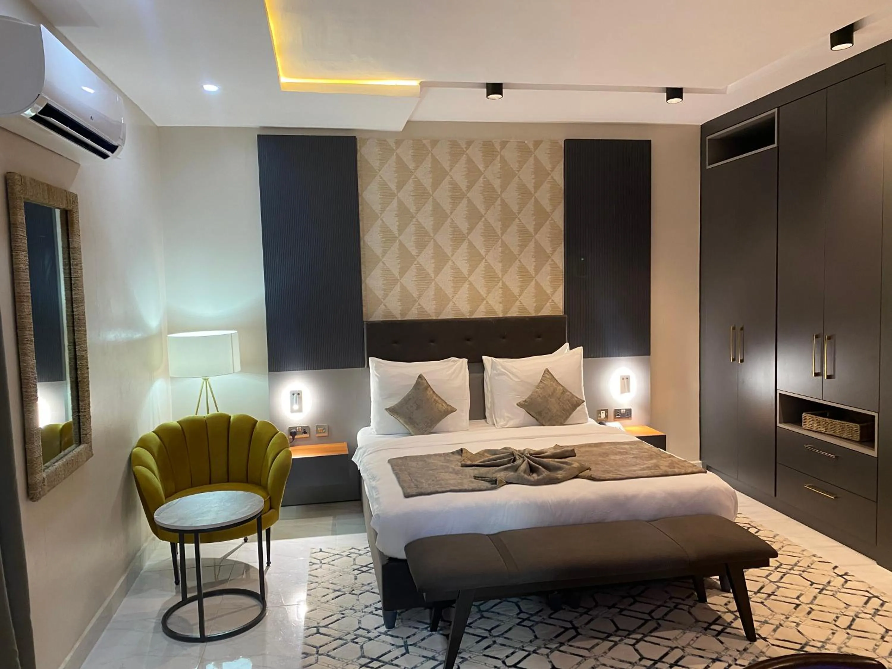 Bed in Wali's Suites