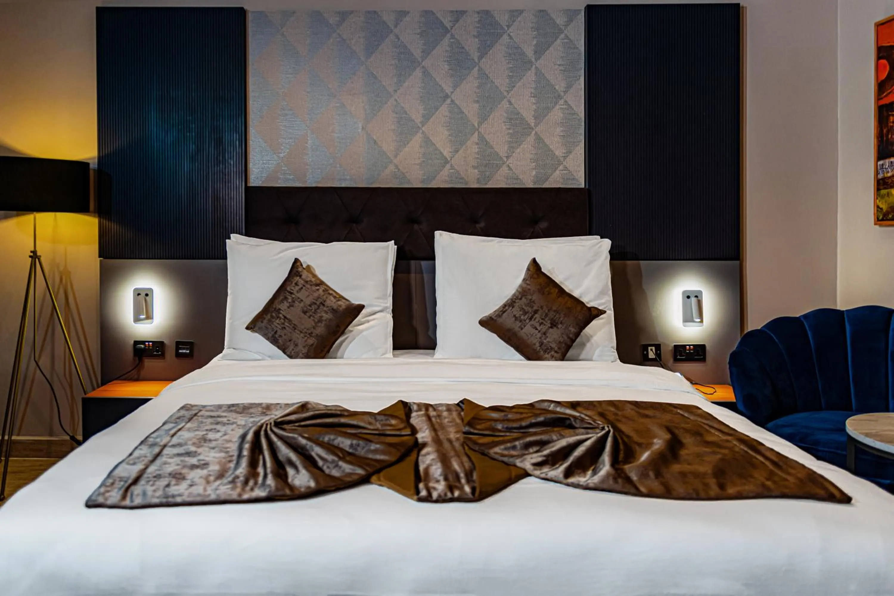 Bed in Wali's Suites