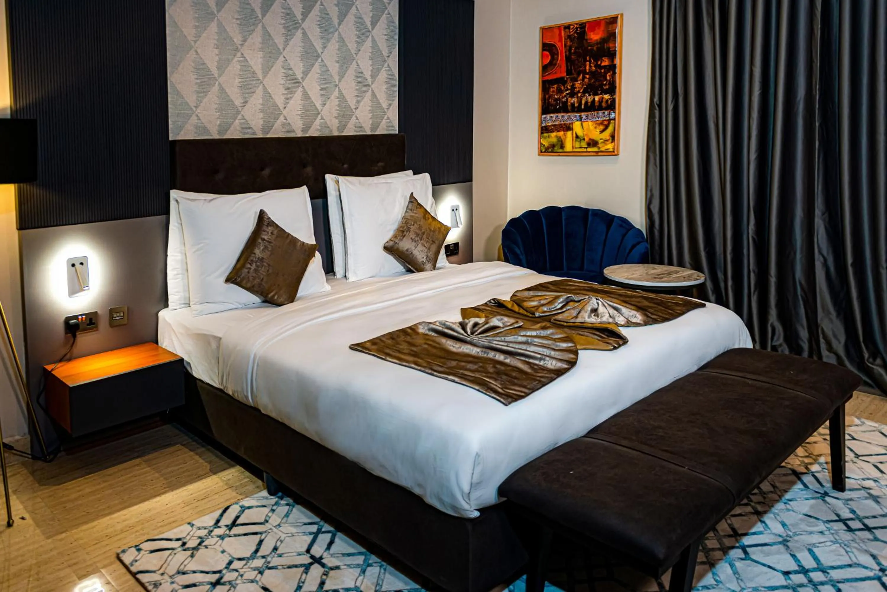 Bed in Wali's Suites