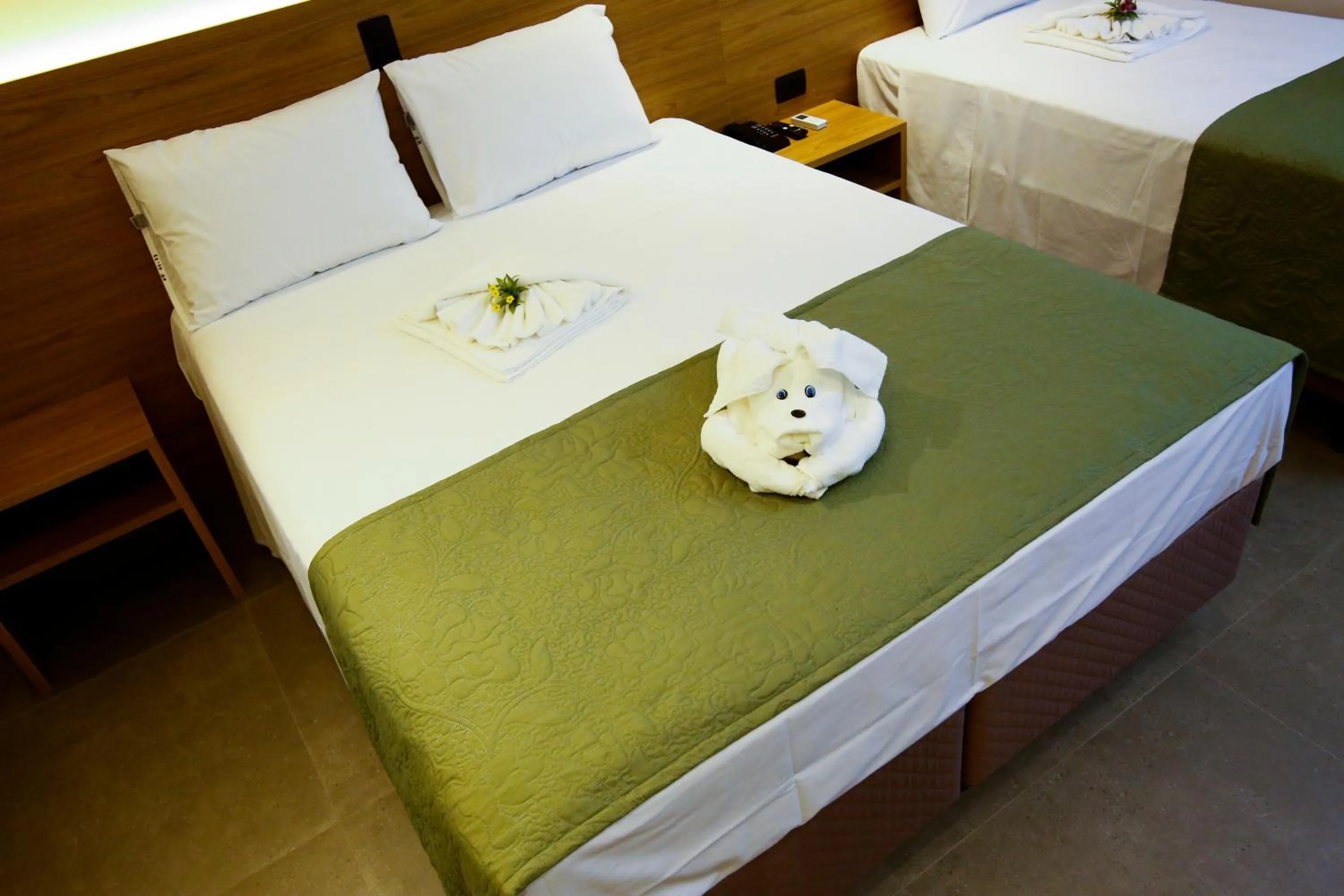 Bed in NEO PARK HOTEL