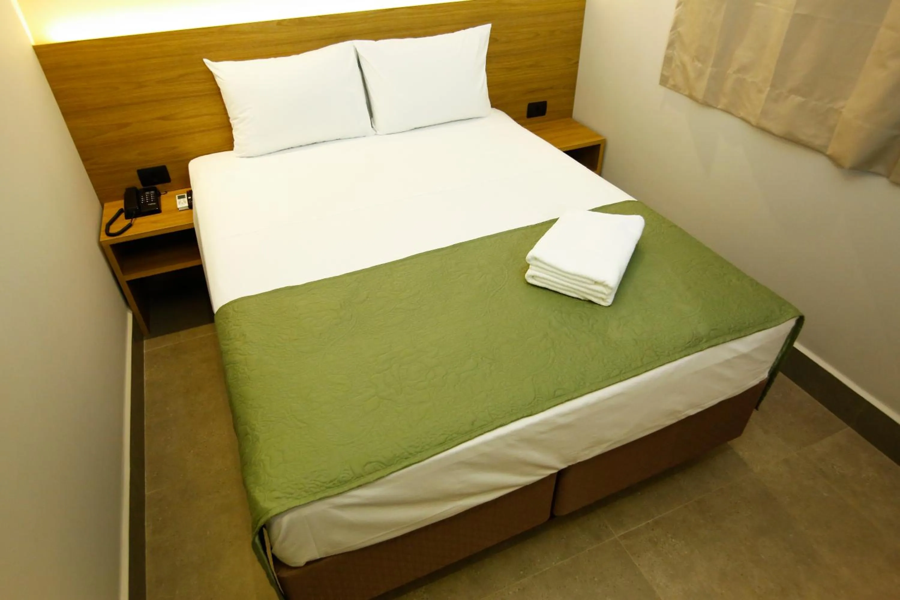 Bed in NEO PARK HOTEL